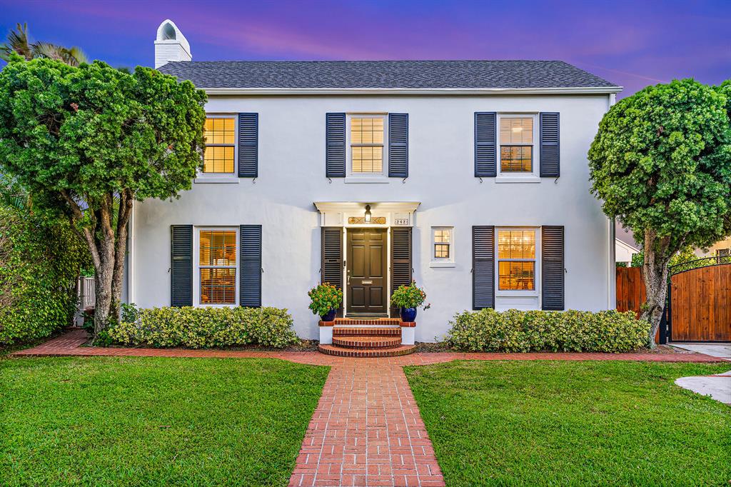 Historic character & charm exude from this beautiful 1940's Colonial residence located on one of the most desirable streets in the coveted South of Southern district. Nestled on a sprawling 11,096 sq. ft. lot, this enchanting home w/ guest cottage boasts over 3,400 sq. ft. Recent updates: impact windows/doors, 2020 roof, interior/exterior painted in classic whites, new patio/balcony/pool decks, & more. Timeless features: hardwood flooring, formal living room w/ wood burning fireplace, formal dining room, & iron stairway banister. Entertain or just get cozy in the large sunroom/family room that overlooks the swimming pool & private, lush backyard. Steps to the Intracoastal Waterway/Flagler Drive. Minutes to beaches, Worth Ave, downtown, fabulous restaurants/shops, the airport, & much more.