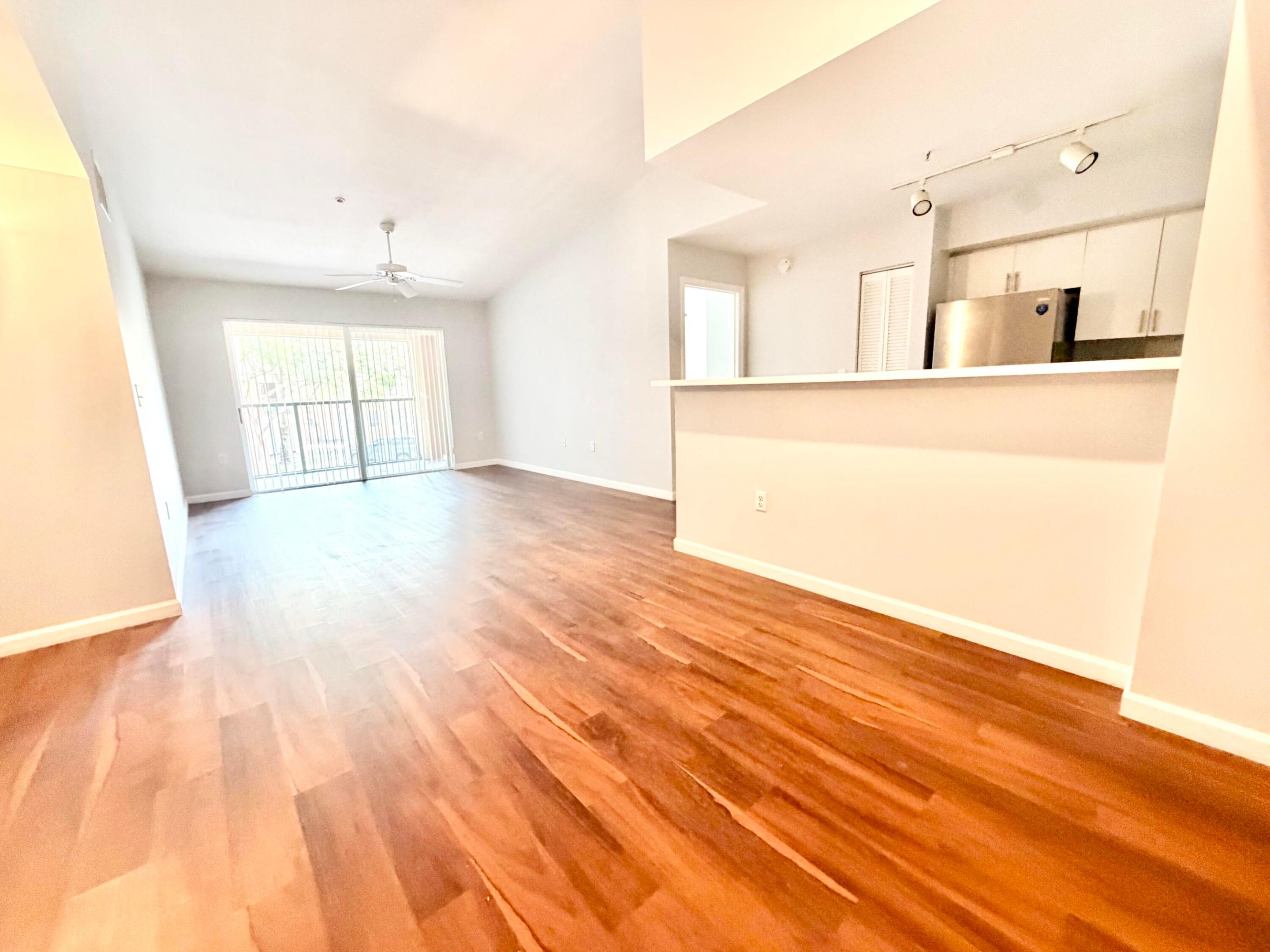 Beautiful move-in ready 2BR/2BA condo in desirable Carrington at Coconut Creek! This spacious second-floor walk up unit features vaulted ceilings, updated vinyl and tile flooring, open living areas, walk-in closet, pantry, private balcony, and in-unit washer & dryer. Bright split-bedroom layout offers comfort and privacy. Resort-style community amenities include pool, tennis courts, clubhouse, and BBQ area. Prime Coconut Creek location near Sawgrass Expressway, shopping, restaurants, parks, and top-rated schools.  Ready for move in.  Easy to show!