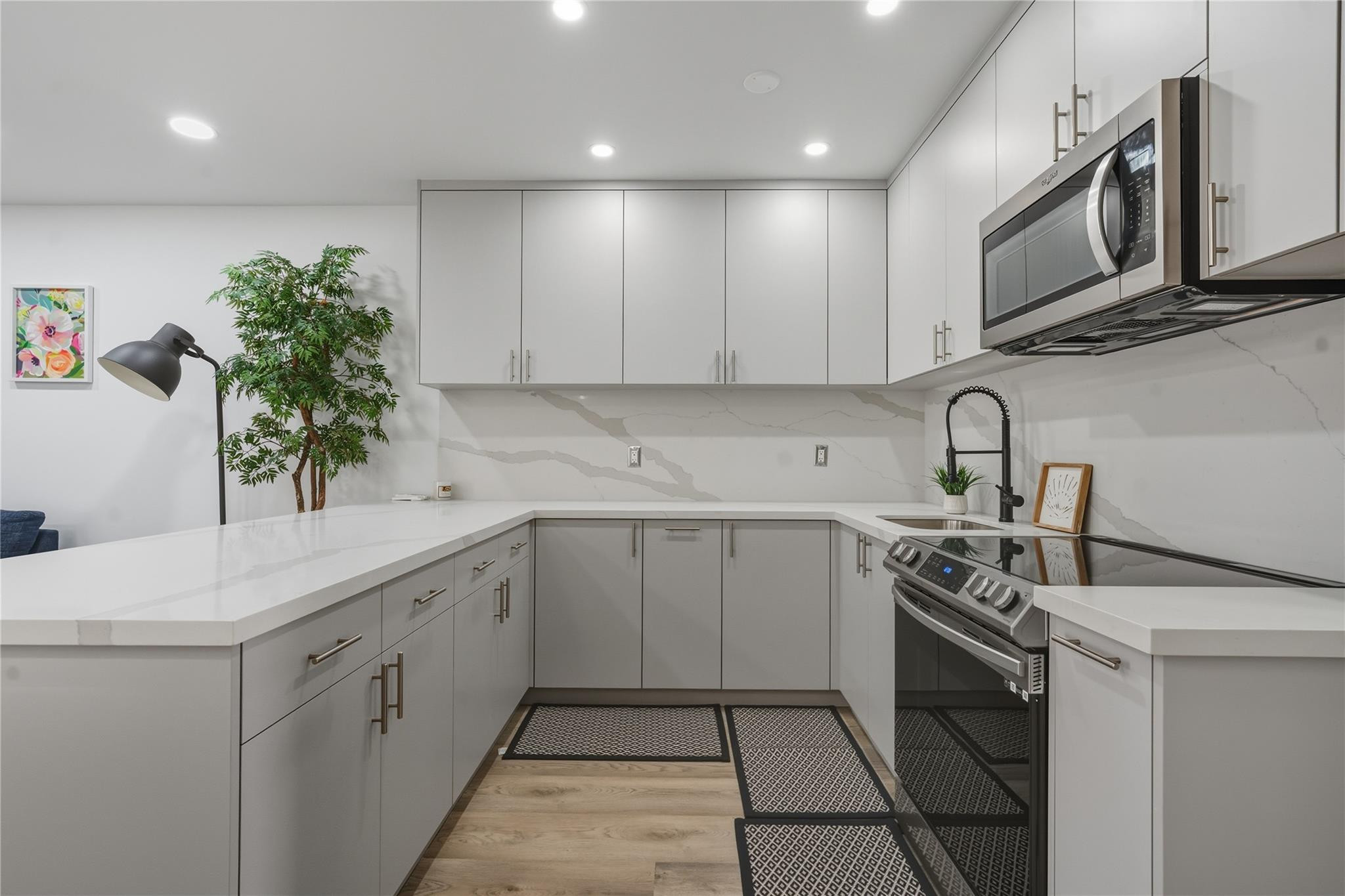 Welcome to this beautifully remodeled ground-floor waterfront co-op in Hallandale Beach, located in a desirable 55+ community. This move-in ready unit has been completely renovated and features modern European-style cabinetry, updated finishes, and a bright open layout. Enjoy a custom closet system for added storage and organization. Step outside your door and take in peaceful water views, perfect for relaxing mornings and sunset evenings. Conveniently located just minutes from the beach, shopping, dining, and entertainment. A rare opportunity to own a stylish waterfront home offering comfort, location, and exceptional value in Hallandale Beach. Leasing is permitted after one (1) year of ownership.