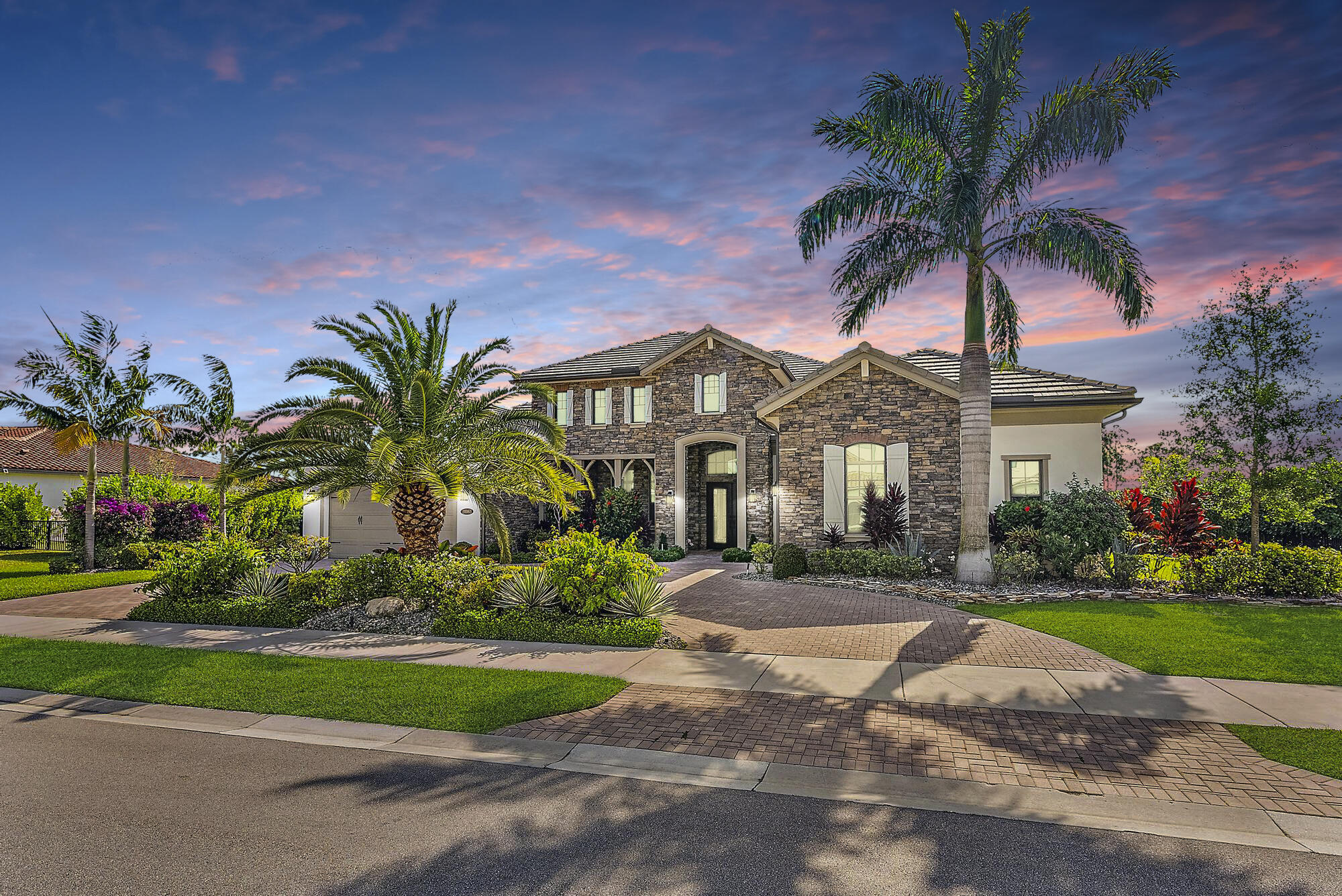 EXTRAORDINARY LUXURY AWAITS - YOUR DREAM HOME IN A GATED COMMUNITY BECKONS!  Step into a realm of refined luxury in this beautifully upgraded 6-bedroom plus den/office, 5.5-bath ranch-style estate residence with a 3-car garage, perfectly situated on a Preserve lot just shy of .6 acres in the prestigious gated community of Prado. Spanning nearly 4,400 square feet, this exceptional home showcases coffered ceilings, custom crown molding, designer wood trim, new interior paint (all walls & baseboards) solid wood doors, custom organized closets, new wood floors in bedrooms, impact windows and doors, custom motorized Hunter Douglas window treatments, high-end draperies, electric blinds, circular driveway, privately custom landscaping from & back, turf backyard, Remi-halo A/C UV light (for both A/C units), new fixtures and more.  Designed for both everyday living and elegant entertaining, the gourmet kitchen is a true showpiece, featuring top-of-the-line Wolf stainless steel appliances, a gas cooktop, double oven, microwave, Asko dishwasher, Sub-Zero refrigerator, custom Wolf wood hood, quartz countertops, and an oversized seamless 3-inch quartz island. Extended cabinetry with custom pull-outs, a butler's pantry, and a large custom-finished walk-in pantry provide exceptional storage and functionality.  The primary suite is a private sanctuary, offering an extended sitting area, coffered ceiling, custom trim, and a spa-inspired ensuite bath with a freestanding soaking tub, dual walk-in shower, and 2 custom-built walk-in closets. The secondary bedrooms are generously sized and beautifully appointed with custom organized walk-in closets, custom wood trim, and ensuite bathrooms, offering comfort and privacy for family and guests.  Additional interior features include a fully equipped custom laundry room with added cabinetry, quartz folding counter, backsplash, under cabinet lighting, newer Whirlpool washer & gas dryer, water filtration system, and elevated finishes throughout. The 3-car garage is equally impressive with an electric car charger, pull-down attic stairs for added storage, freshly painted, and high-grade epoxy floors.  The fully turfed and custom-landscaped backyard is designed for resort-style living, featuring a covered lanai with tongue-and-groove ceiling detail, large custom wood fan, electric screen enclosure, custom Pebbletec finished heated, saltwater pool, hot tub, sandblasted white marble decking, summer kitchen, and a putting green. Every detail was thoughtfully curated to create an exceptional indoor-outdoor lifestyle.  Ideally located close to grocery stores, exquisite dining, shopping, schools and everyday conveniences, with easy access to I-95 and the Florida Turnpike, this remarkable Prado estate offers luxury, comfort, convenience, and timeless sophistication in one extraordinary residence.