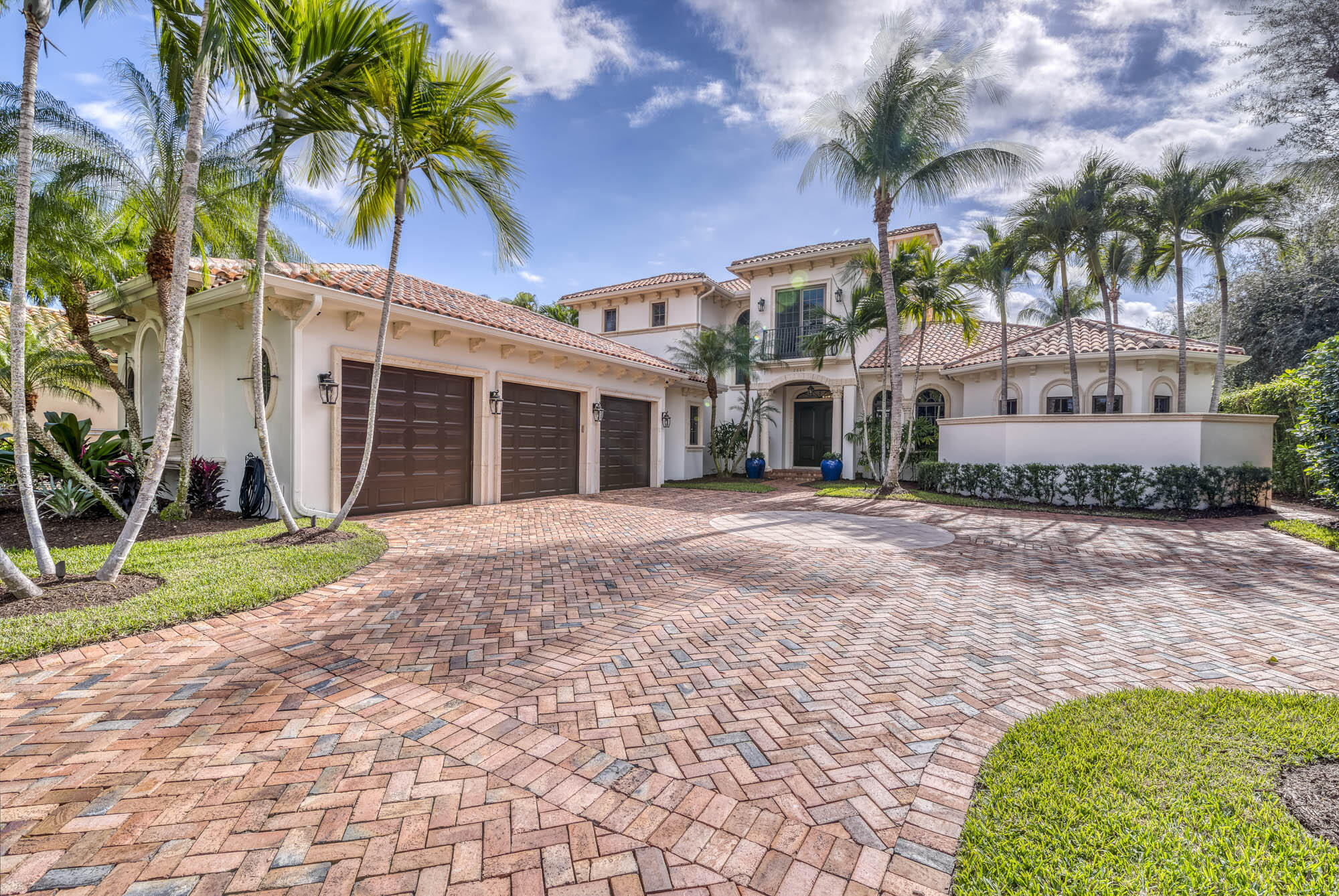Spectacular, fully renovated estate home on navigable water, intracoastal and ocean access, southern exposure, in the gated community of The Cove. Best lot in the neighborhood with long canal view on 1/2 acre in cul de sac. 5 bedrooms, 6.5 baths, exercise room/6th bedroom, office, and game room. Downstairs master, office, and guest room. New oak flooring throughout, incredible new kitchen, subzero/thermador appliances. All new lighting, pool/spa remodeled, new outdoor kitchen. Quality finishes and construction. New 10,000 pound lift and refinished dock. Poured concrete second floor, impact doors and windows. Just over a mile to the beach.