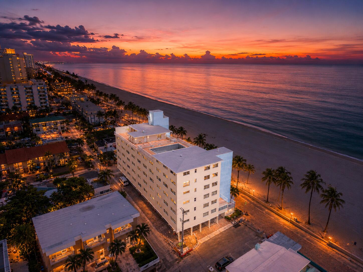 Experience boutique coastal living in this fully renovated 2BR residence within an Art Deco-inspired 6-story condo directly on the oceanfront and Hollywood Broadwalk. Enjoy sweeping views of the Atlantic to the east and Intracoastal to the west—one of the most coveted Broadwalk locations. Inside, light neutral finishes, Italian porcelain tile with soundproofing, and Level 5 ceilings create a modern, airy feel. Raised bulkheads add height, while the sleek kitchen features new appliances and an island cooktop with ocean views. Bathrooms are custom designed with high-end finishes, designer lighting, and unique mirrors. Additional upgrades include hurricane-impact windows and doors, motorized blinds, custom window seating, new ceiling fans, and washer/dryer hookup.  This smoke-free building offers a rooftop deck, pool under renovation, gated covered parking with prime assigned space, storage, strong management, reserves, and ongoing 60-year recertification. Steps from the sand, designed for style, comfort, and oceanfront living.