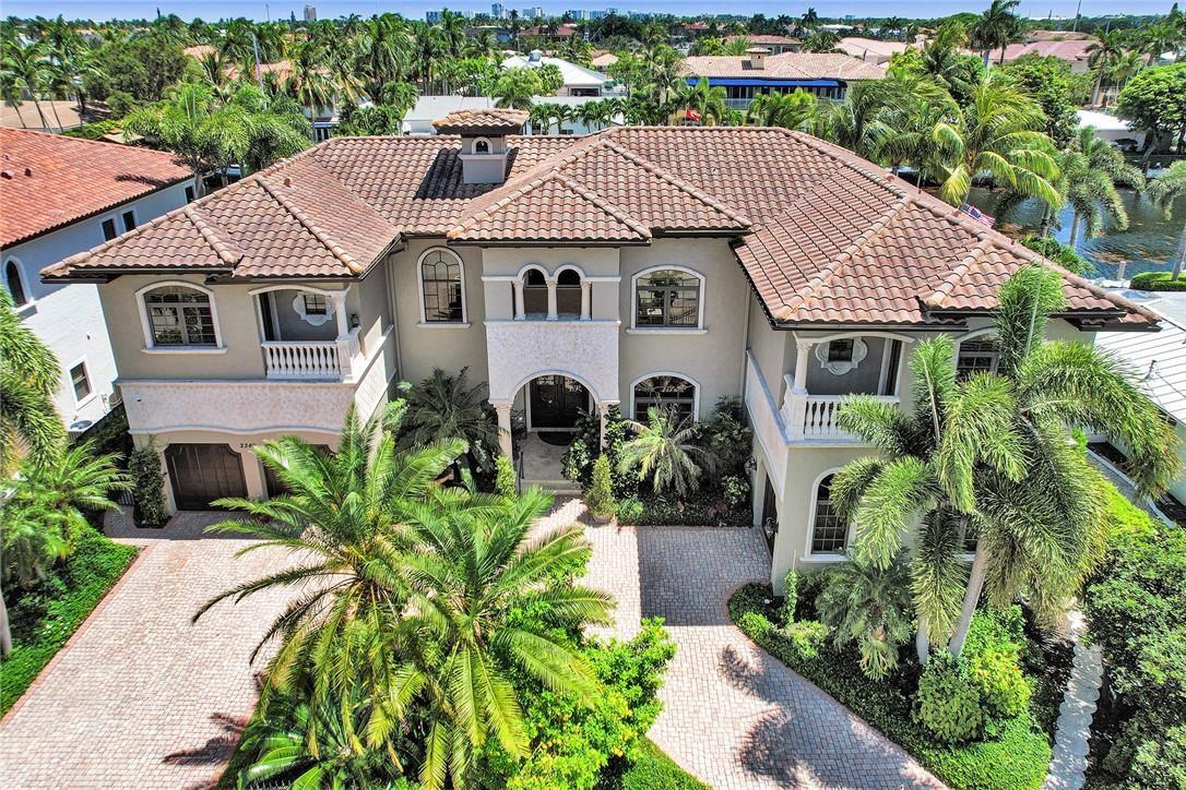 Elegant LHP Estate Home Immaculately Maintained on 100' of Wide Canal with Deep Water Access No Fixed Bridges. Minutes to Hillsboro Inlet. Surrounded by Mature, Lush, Tropical Plantings. Grand Double Height Entryway Boasts a Soaring Fireplace. 6 bedrooms (5 are Ensuite) 7 1/2 baths plus Office/Den - All outfitted with Crown Molding + Premium Casings. Large Master Suite with Double W/C and Huge Closets. Two Laundry Rooms, Elevator, Sub Zero/Thermador Appliances in Oversized Open Kitchen Concept with Huge Pantry. Formal Dining Room and Large Family Room  with Sunken Bar An Entertainer's Paradise. Southern Exposure Allows Year-Round Sun on Heated Pool & Dock. Outdoor Kitchen with Sink, BBQ Grill and Refrigerator. Secured Gated Front with Extra large driveway 3 car garage. Furniture negotiable