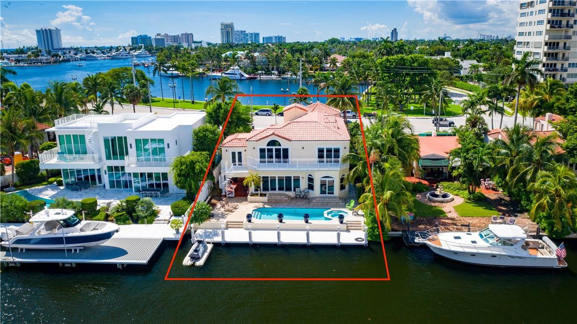 Magnificent waterfront estate, with no fixed bridges and direct ocean access. This gated residence is only 2 houses from the point! Fully renovated in 2021 both inside and out, with impact glass, whole-house generator, and new chef-inspired kitchen cabinets and appliances. New metal roof to be installed Mid-September! Enjoy the new travertine pool deck and views of the intercostal or be mesmerized by the southerly views over Idelwyld Park, where sailboats anchor and yachts motor by. Experience the best of the Las Olas waterfront lifestyle!