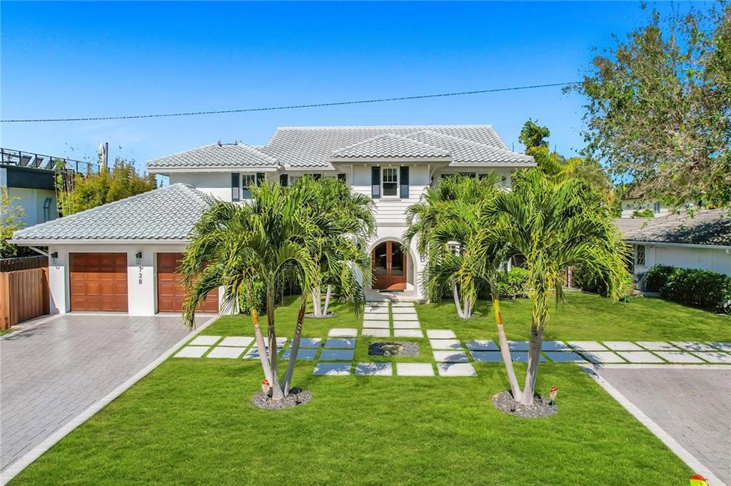Spectacular 4 bedroom + office residence in the sought after neighborhood of Sunrise Intracoastal. Beautifully renovated in 2017 offering quality updates at every turn. Gourmet kitchen with custom cabinetry, Jenn Air appliances, gas cooktop and large center island with seating for 6. Oversized family room offers plenty of natural light, gas fireplace and beverage center. Temperature controlled wine room with storage for 150+ bottles and custom flooring made from recycled wine barrel staves. Primary suite fitted with walk-in closet, spa like bath and private terrace. Features: impact windows/doors, upstairs and downstairs laundry rooms, vaulted ceilings, natural gas and more. Backyard boasts screened-in patio, gas grill, pool and lush landscaping. Bayview Elementary school district.