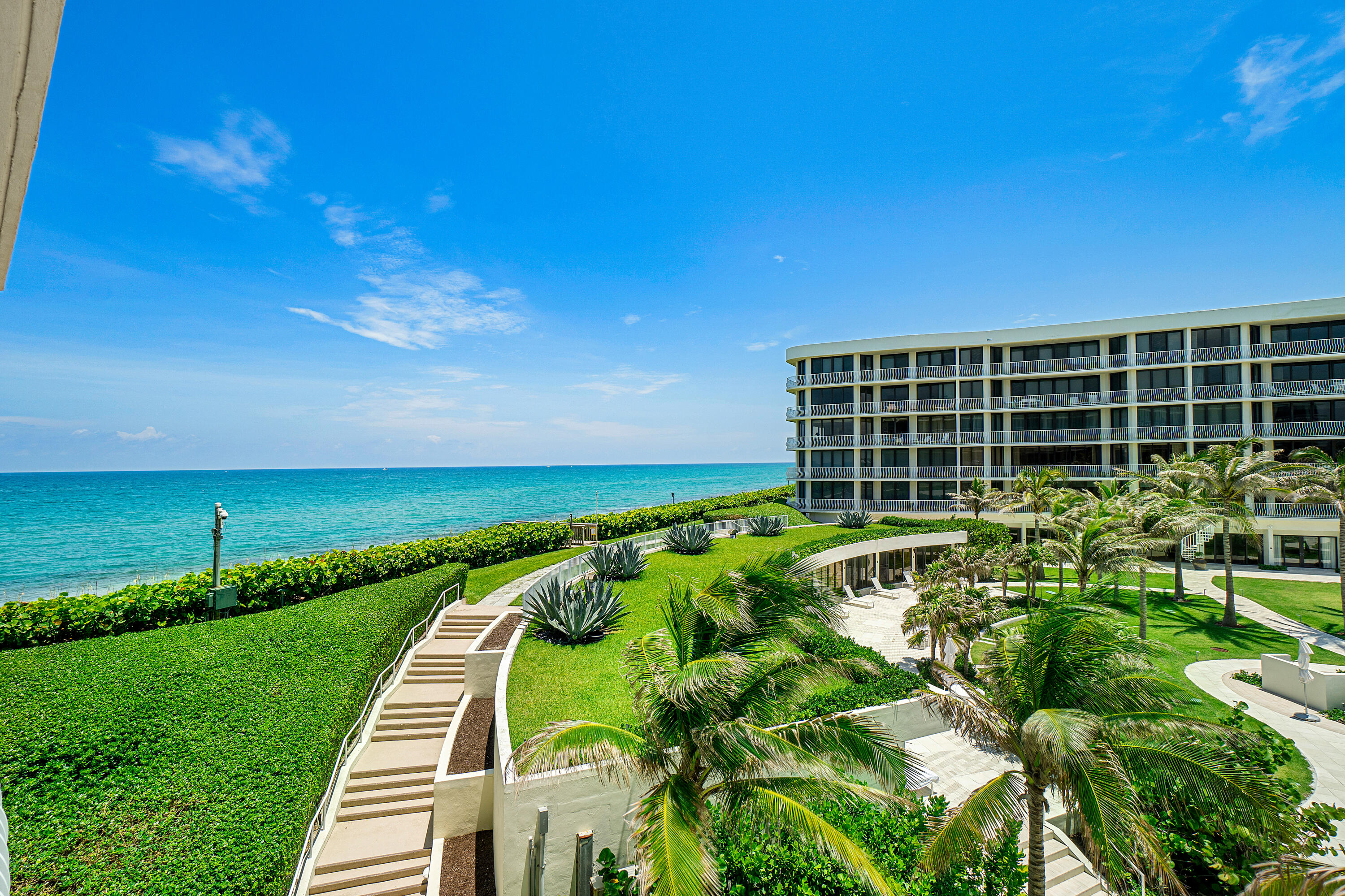 This beautifully redone 2 bedroom, 2.1 bathroom Sloans Curve apartment offers stunning Ocean & Intracoastal views from its sun-filled southern exposure. Enjoy the scenery from the wide terrace overlooking the new pool area. The open kitchen, wood floors, 9-ft ceilings, spacious rooms, impact doors, electric shades, and steam shower are just a few of the many upgrades. This oceanfront building boasts magnificent lobbies, a fitness center, six Har-Tru tennis courts with a pro shop, and a pool attendant who sets up chairs, umbrellas, and cabanas on the beach. Additional features include a 24-hour door attendant, gated entry, and two garage spaces. Located just minutes from Worth Avenue, fine dining, cultural centers, and top resorts, this home offers the ultimate in Palm Beach luxury living!