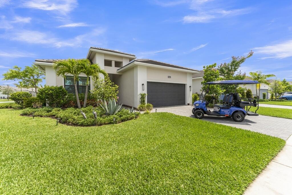 Everything you're looking for awaits in the highly sought-after community of Westlake. From scenic trails & year-round events to the incredible resort-style amenities & fun water park, this vibrant community offers an exceptional lifestyle for you & your family.  This like-new home, built in 2023, & less than 3 yrs old, is situated on a premium oversized corner lot with stunning lake views & exceptional privacy. The property includes a fully loaded lithium-ion 2023 *Golf Cart*, perfect for exploring!  The Fiesta model in Cresswind offers flexible living space with 3 bedrooms, 3 full baths, and a spacious *Den* that can easily be converted into a **4th Bedroom**! The oversized primary closet is located behind an adjoining wall, making a **4th Bedroom** conversion simple if desired.  Alternatively, enjoy the current layout with a beautiful, expansive den perfect for a home office, media room, or guest space.  Currently styled as a sophisticated French farmhouse with Southern charm, the home features modern, high-end finishes throughout. The Chef's Kitchen is a true showpiece, highlighted by stunning double-thick mitered quartzite countertops and premium finishes. It is exceptionally gorgeous with no detail spared.  Located on a quiet street, you're just a short walk from Club Cresswind, where residents enjoy an active lifestyle with fitness classes, concerts, social events, a state-of-the-art fitness center, pool, bocce ball, tennis courts, pickleball, and endless recreational opportunities.  The sellers invested extensively in upgrades and improvements, originally intending this to be their forever home. Features include:  • Full impact-resistant construction, including all windows and garage door. • Epoxy finish garage perfect for workspace. • Soaring tray ceilings in foyer, great room, and master bedroom. • Custom wood plantation shutters throughout. • Fully fenced backyard with magnetic-lock gates, ideal for pets. • Screened lanai and panoramic impact sliders. • Beautiful lake views from the main living areas through a large picture window. • Wired security alarm system. • In-wall and in-ground Taexx pest control system with upgraded termite protection. • Spacious primary suite with a zero-entry massive walk-in shower. • Deep linen closets and an exceptionally large primary closet that can accommodate *4th Bedroom* if Den is converted. This model was designed uniquely.   The fenced in backyard offers ample space to build your dream pool and spa, creating the perfect private outdoor retreat.  For added peace of mind, the home includes transferable warranties covering plumbing, electrical systems, appliances, and major components. The roof carries a 10-year warranty with approximately 7 years remaining, and many warranties may be extended by the new owner. All ceiling fans are Hunter brand and can be converted with light kits. All LED lighting recessed, very beautiful and bright!   Cresswind is an exceptionally active community designed for resort-style living. While primarily a 55+ community, up to 20% of households may be under age 55 until the community cap is reached, offering unique flexibility for active families.   With its premium lot, extensive upgrades, lake views, impact construction, and like-new condition, this beautifully built home is truly a must-see.