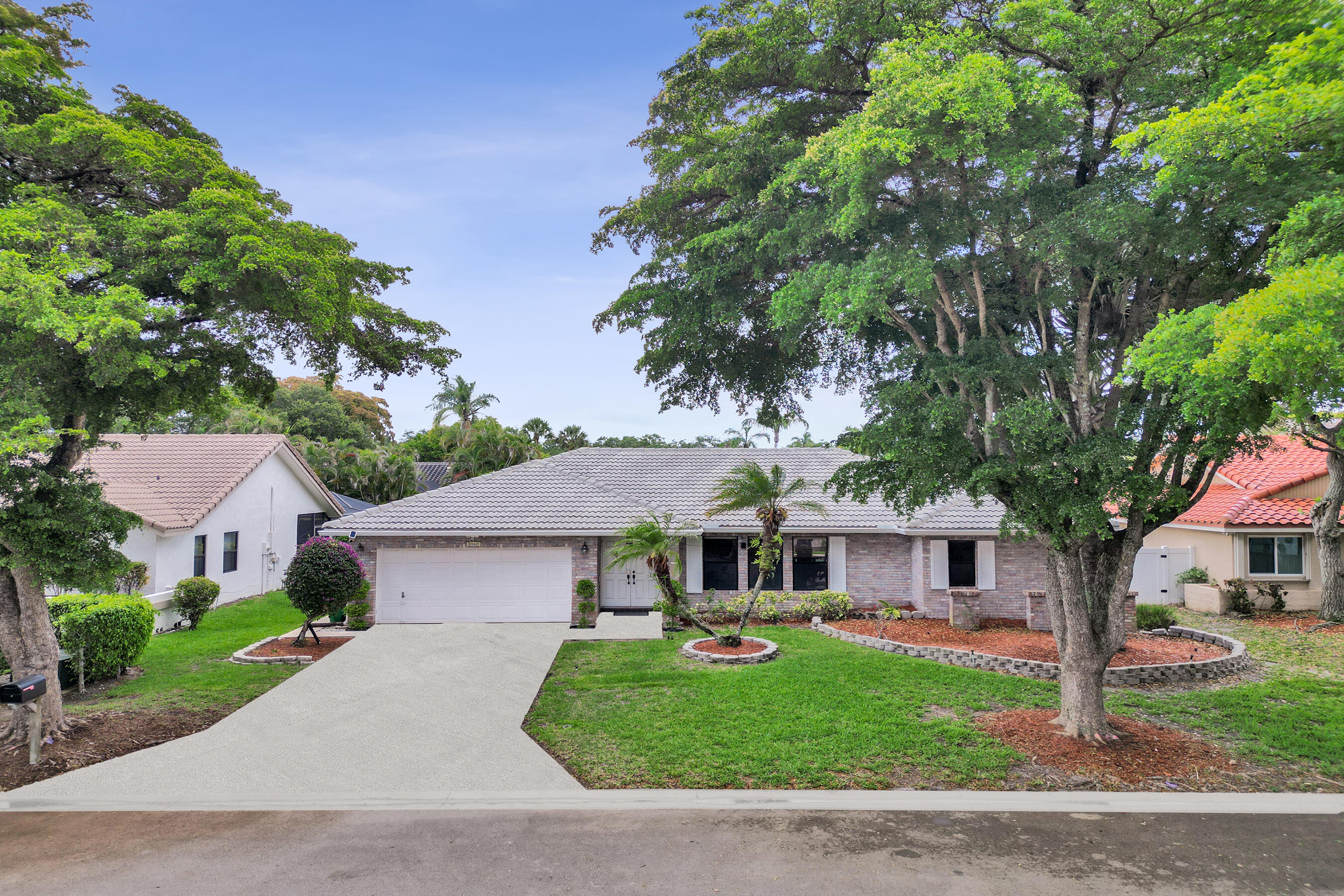 Located in the desirable Hidden Hammocks at Butler Farms, this beautifully updated 4 bedroom, 2 bathroom home offers a spacious split bedroom floor plan and numerous updates throughout. Features include an updated kitchen, tastefully updated bathrooms, interior paint, light fixtures, zebra shades, 2024 A/C, 2024 stainless steel appliances, 2025 LG washer and dryer, 2024 sprinkler pump, 2025 pool heater, and 2024 solar panels. Enjoy South Florida living with a private screened Salt system pool, spacious covered lanai, and fully fenced backyard with lush green space perfect for entertaining, pets, or play or simply unwinding. Conveniently located within walking distance to Park Springs Elementary and close to parks, shopping, dining, and major roadways.