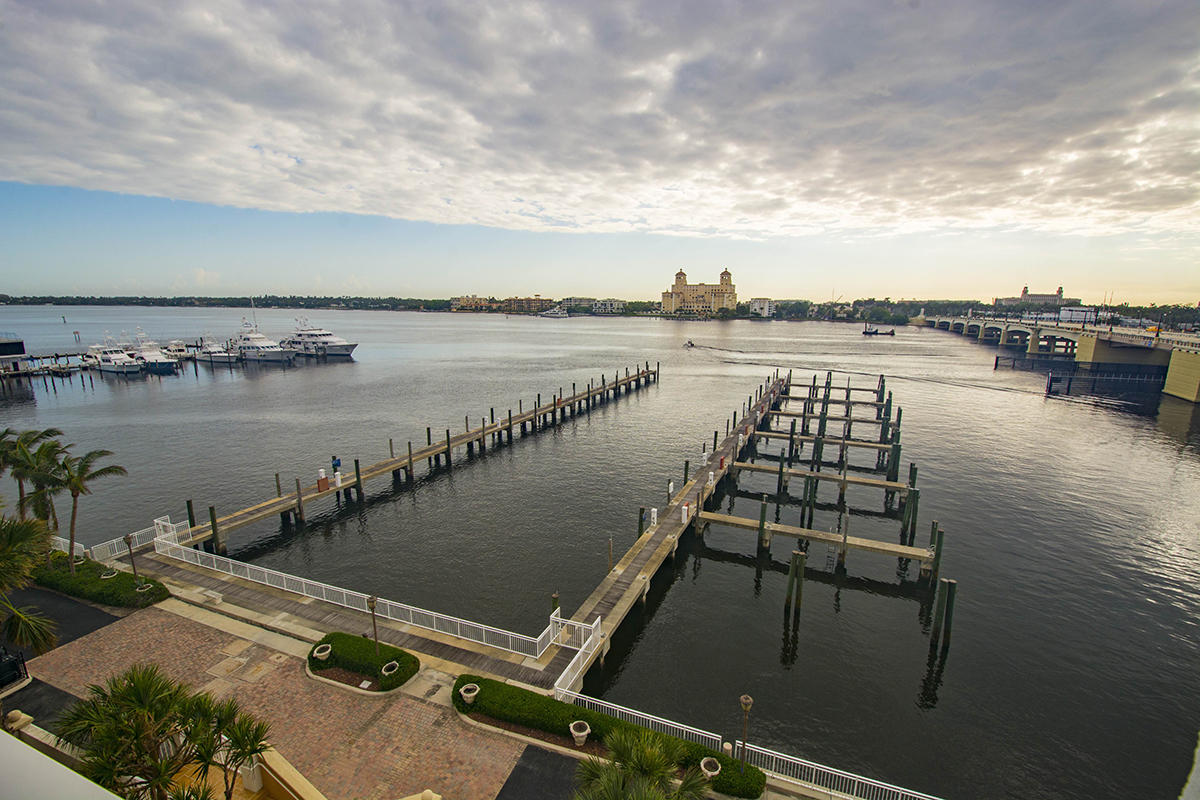 One Watermark Place has set the standard for high end luxury waterfront living in Palm Beach. Boasting over 6,400 square feet with four bedrooms and four full and one half baths plus an office/den in the lavish master suite. The layout of the massive gourmet open kitchen and family room offers enough space to entertain a large group of family or friends. A gracious butler's pantry separates the kitchen from the formal dining and living rooms. Walls of impact glass are plentiful from this fabulous 4th floor residence that faces the water from three directions capturing the finest possible views of the Intracoastal Waterway, Palm Beach and downtown West Palm Beach. From the huge covered balconies you have the Intracoastal, 24-slip private Marina and the Palm Beach Yacht Club just below you making this a boat lovers paradise.