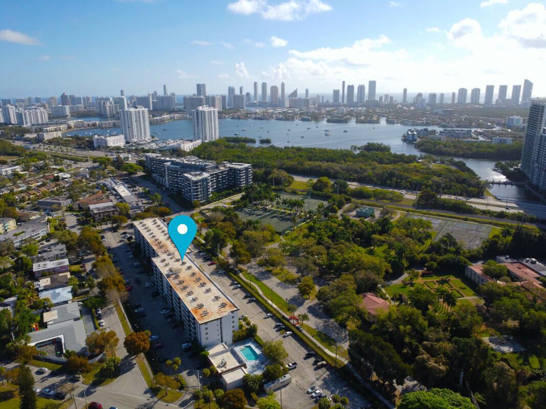 Spacious 1-bedroom, 1-bath residence at Woodside offering comfort, convenience, and value in North Miami Beach. Features include a brand-new bathroom, new A/C, hurricane-impact windows, and a bright open layout with peaceful garden views. Gated building with secure lobby, pool, laundry, elevator, and assigned parking. Minutes from Biscayne Blvd, 163rd St, Aventura Mall, shopping, dining, and essentials.  VS pictures