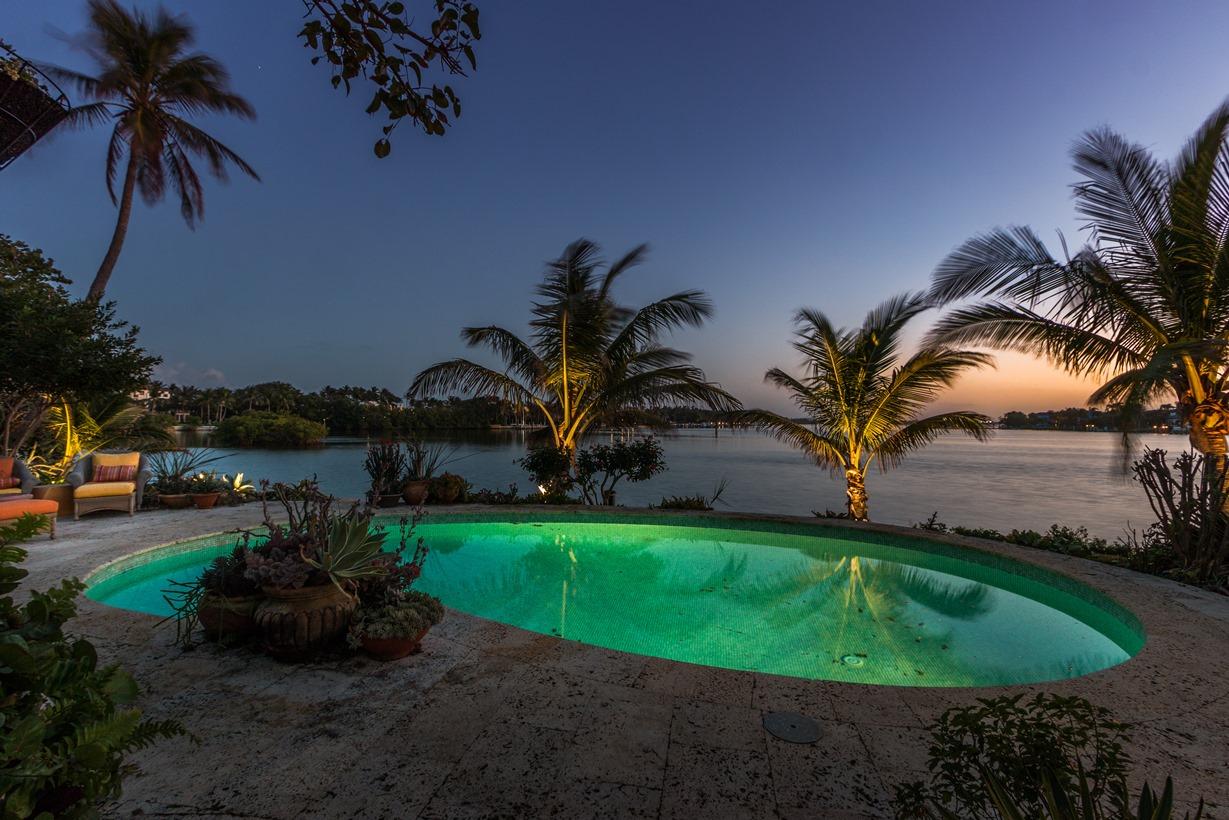 Sweeping water views from this custom home at the tip of Point Manalapan.  This spectacular 1 story home was custom built by renowned architect Henry Harding, updated by the current owner, famed designer Renny Reynolds, and appeared as the cover feature in the June issue of Elle Decor in 2008.  It has been updated while still retaining the feel and look of the homes that made living in this upscale community truly special. Built on more than half an acre at the very point of Manalapan, this home can be your tropical oasis, surrounded by lush gardens, mature landscaping and panoramic views of the waters surrounding Point Manalapan. If privacy and security are as important to you as luxurious living in a custom home, you'll love being part of a town of only 350 residences, and the warmth and friendliness of neighbors who share your desires for only the best life has to offer.

Manalapan home ownership and residency comes with a gratis membership to the La Coquille Club, a cherished part of the Manalapan experience. Members are granted access to the club's many amenities, including pool, spa, private beach, tennis, golf, a business center, fitness and club room. Members are not charged initiation or fees and are billed only for the goods and services enjoyed while at the club. 

Located just 20-minutes from both the heart of Palm Beach and world class shopping along Worth Avenue, is the exclusive seaside town of Manalapan. Rated by Forbes as the most elite zip code for multi-million dollar waterfront homes in America, Manalapan offers gorgeous sandy beaches, turquoise waters, and unique amenities including membership at the very exclusive La Coquille Club at the Eau Spa Hotel. For the discriminating home buyer, this fabulous lifestyle is available at a fraction of the cost of comparable home ownership in Palm Beach. With 192 of Manalapan's 200 luxurious homes providing direct water access for boaters, this extremely private, secure and very exclusive island location is the best value among south Florida's million dollar plus upscale living communities.