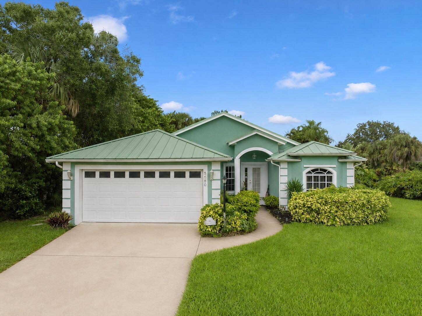 Beautifully maintained 3BR/2BA single-family home in desirable Sylvan Lakes, Vero Beach, situated on a spacious corner lot with tropical curb appeal & a private screened pool. Offering approx. 1,916 sq ft of comfortable single-level living, this home features a 2-car garage, functional floor plan, generous living areas, & a distinctive colored standing seam metal roof that adds durability, character, & long-term value. Enjoy easy indoor-outdoor Florida living with space to relax, entertain, and enjoy the pool year-round. Conveniently located near beaches, shopping, dining, parks, schools, medical services, golf, & everyday conveniences. Property is on public water & sewer, with a well for irrigation. A strong combination of lifestyle, location, curb appeal, & value in Vero Beach. Photo Disclosure: Some interior photos have been digitally modified to reflect the interior condition prior to tenant occupancy. Buyers should verify the current condition of the property through personal inspection, walkthrough, and due diligence.