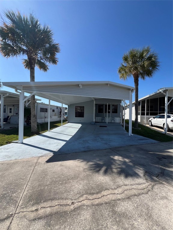 ~Ancient Oaks~ 55+ Community. 2 Bed 1 Bath Park model w/addition. Furnished- on a double street. Huge carport for Truck & Boat or 2 vehicles. Outside shed with washer & dryer, Golf cart included