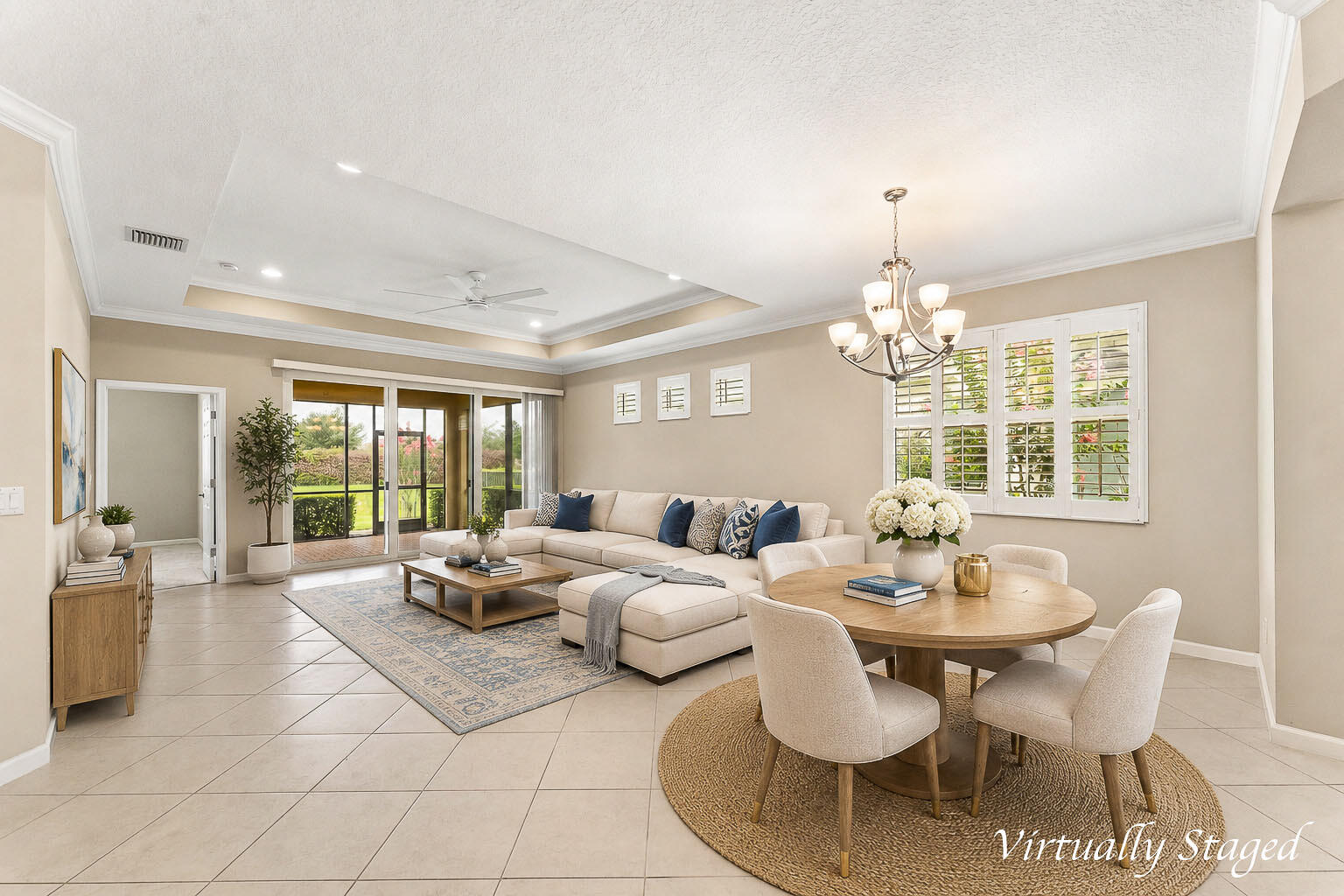 Welcome to effortless Florida living in the highly desirable LakePark at Tradition, a premier gated 55+ community. Built in 2019, this beautifully maintained residence offers 2 bedrooms, 2 bathrooms, and 1,742 square feet of thoughtfully designed living space.  Step inside to an open-concept floor plan featuring abundant natural light, spacious living and dining areas, and a well-appointed kitchen designed for both everyday living and entertaining. The split-bedroom layout provides privacy for homeowners and guests alike, while the generous primary suite offers a peaceful retreat with ample closet space and an en-suite bath.  Enjoy indoor-outdoor living with a private lanai, perfect for morning coffee or evening relaxation. The attached two-car garage provides additional storage and conven