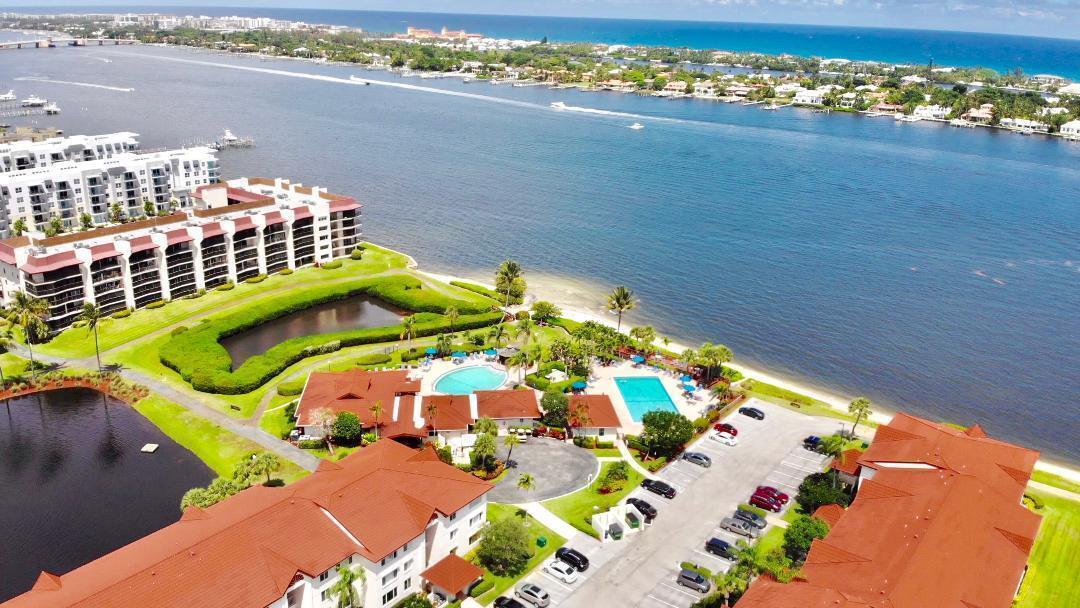 INTRACOASTAL WATER VIEW FROM UPDATED 2 BR HALF MOON BAY CONDO. Beautiful Intracoastal view from living room and patio. Tile floors, Granite Counter Top, Washer and Dryer, updated bathrooms... Half Moon Bay Hypoluxo is a superb Intracoastal waterfront community with resort ambiance featuring ocean breezes and leisure strolls along the sand beach. There are two lovely heated pools, hot tub, saunas, promenade lounge deck and gazebo along the waterfront. The clubhouse is inviting and comfortable and the scene of the many eclectic parties sponsored by the community Social Committee. There are three tennis courts and a bocce ball court for residents and guests. All of this in a gated community close to all that the Palm Beaches offer:..beaches, shopping, entertainment, restaurants.