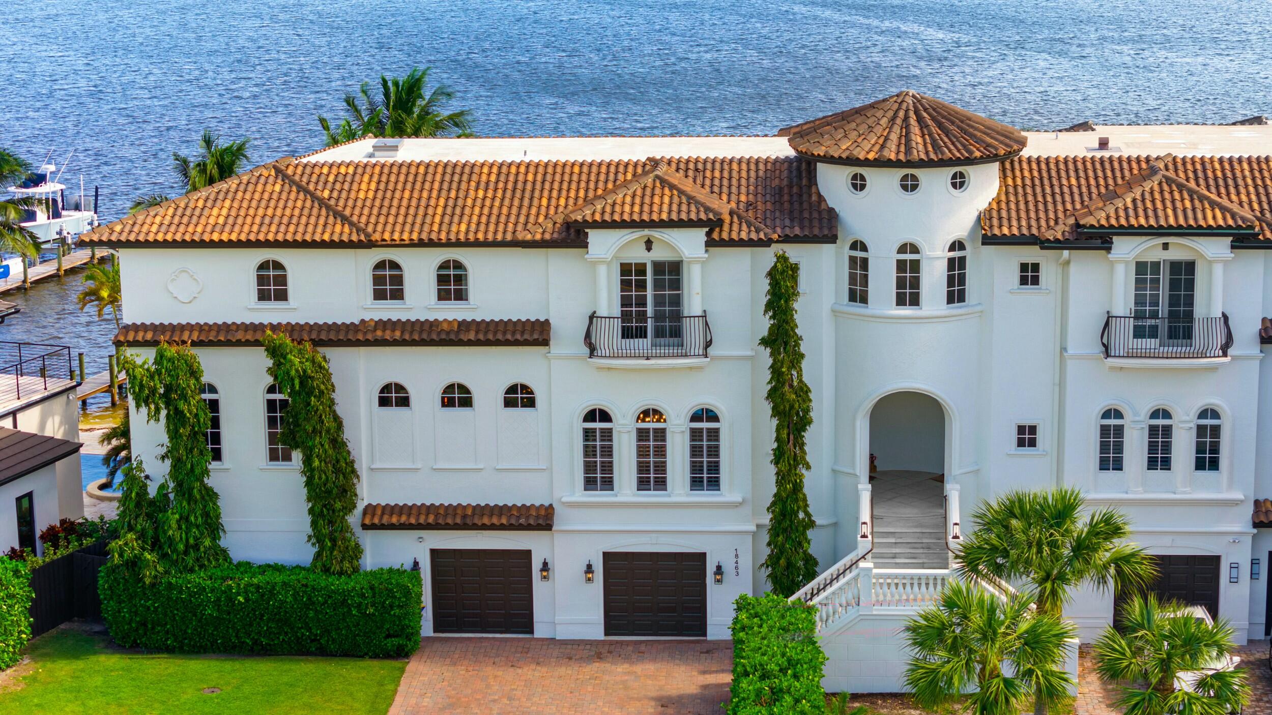 This stunning four-bedroom, four-and-a-half-bathroom waterfront estate with private beach offers unparalleled luxury and breathtaking water views from nearly every room. Perfectly situated on the serene Intracoastal Waterway and just a few minutes away from the Atlantic Ocean through the Jupiter Inlet with no fixed bridges, this home promises an extraordinary living experience. Boasting 12-foot ceilings, expansive open spaces, and high-end finishes, this residence exudes sophistication and elegance. The kitchen is a culinary dream, featuring top-of-the-line thermador appliances, gas range, custom refrigerator, wine cooler, and custom cabinetry, all designed for both style and functionality. Herringbone oak floors and marble tile, motorized blinds, and custom trim enhance the beauty and craftsmanship throughout the home.

Step outside to discover your private oasis. A sparkling private pool overlooks the water, providing the ideal setting for relaxing or entertaining. Two outdoor kitchens, a private beach and a private boat dock with a 40,000 lb boat lift and double jet ski lift complete the ultimate waterfront lifestyle. Whether you're enjoying a peaceful sunrise or taking your boat out for a day of adventure, the waterfront views are simply mesmerizing.

Every floor of this magnificent home features its own patio, allowing you to enjoy the serene surroundings from multiple vantage points. The home includes a private exercise room, sauna, and expansive outdoor beachfront patio. The master suite is a true retreat, offering panoramic water views, walk in closet and a spa-like bath. With hurricane impact windows, an elevator for convenience, and a two-car garage, this residence is built to provide both luxury and peace of mind.

Available fully furnished, this exceptional home is designed for those who appreciate the finest things in life...an exclusive, turn-key property where comfort and opulence meet in perfect harmony.