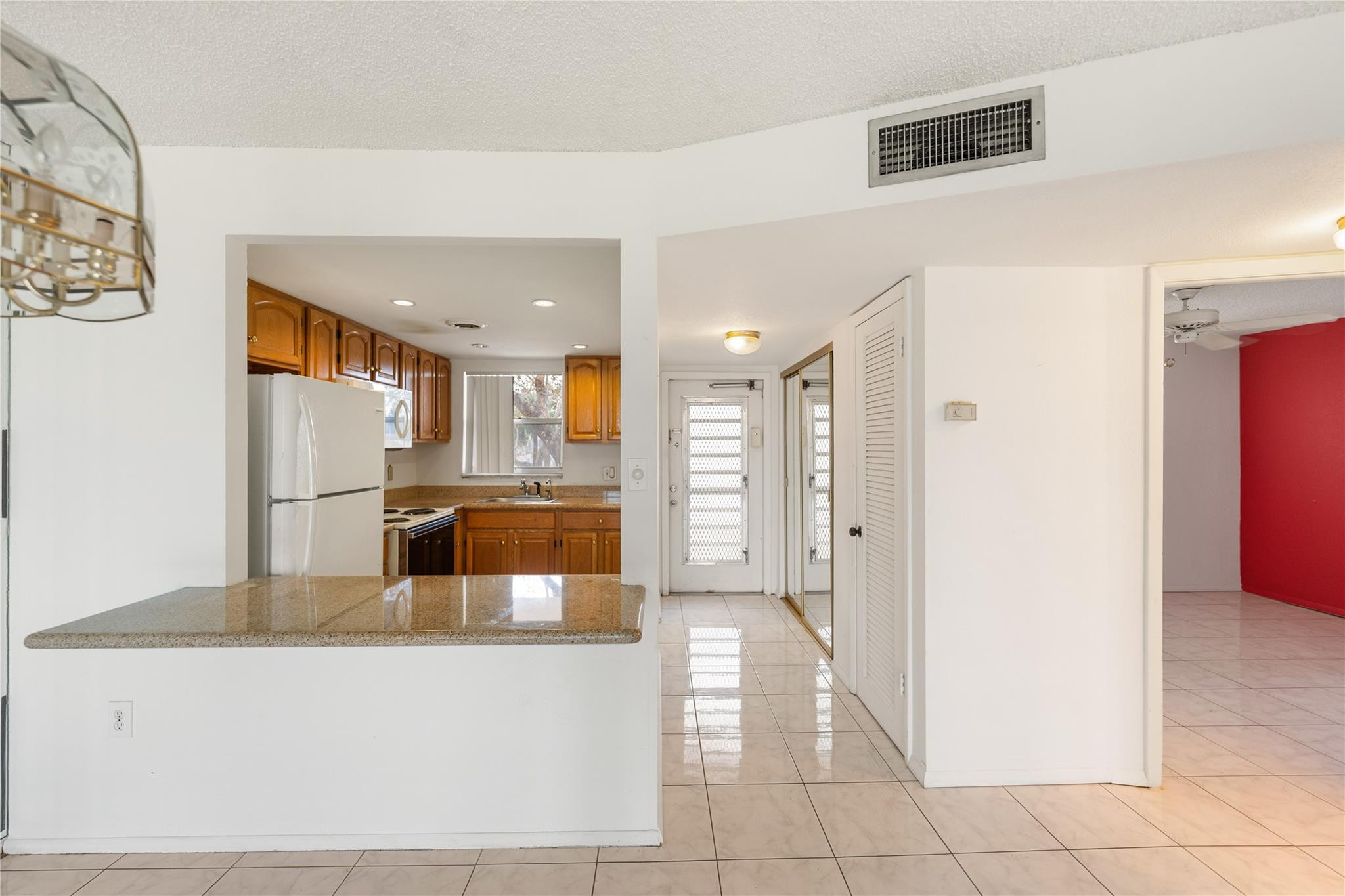 Spacious and bright second-floor two-bedroom, two-bath condo featuring ceramic tile throughout, an upgraded kitchen, and well-maintained bathrooms with modern touches. Each bedroom includes its own walk-in closet for added convenience. Enjoy a private balcony overlooking a small serene lake that runs parallel to the building. Ideally located across from the clubhouse with a pool, fitness center, and multiple tennis courts—offering a comfortable and convenient lifestyle.