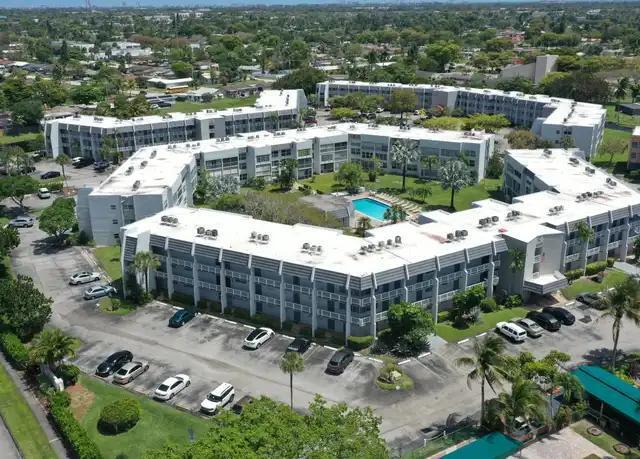 Welcome to this spacious and well-maintained 1-bedroom, 1.5-bath condominium located in the desirable Royal Park Gardens 55+ community in the heart of Margate. This bright second-floor residence offers a comfortable and functional floor plan featuring an oversized living and dining area, a generous primary suite with a private full bath and ample closet space, plus the convenience of a separate half bath for guests. Relax on the enclosed screened balcony overlooking the beautifully landscaped grounds, creating the perfect space to enjoy your morning coffee or unwind at the end of the day. Whether you're looking for a seasonal retreat or a year-round residence, this home offers exceptional value and endless potential to make it your own.