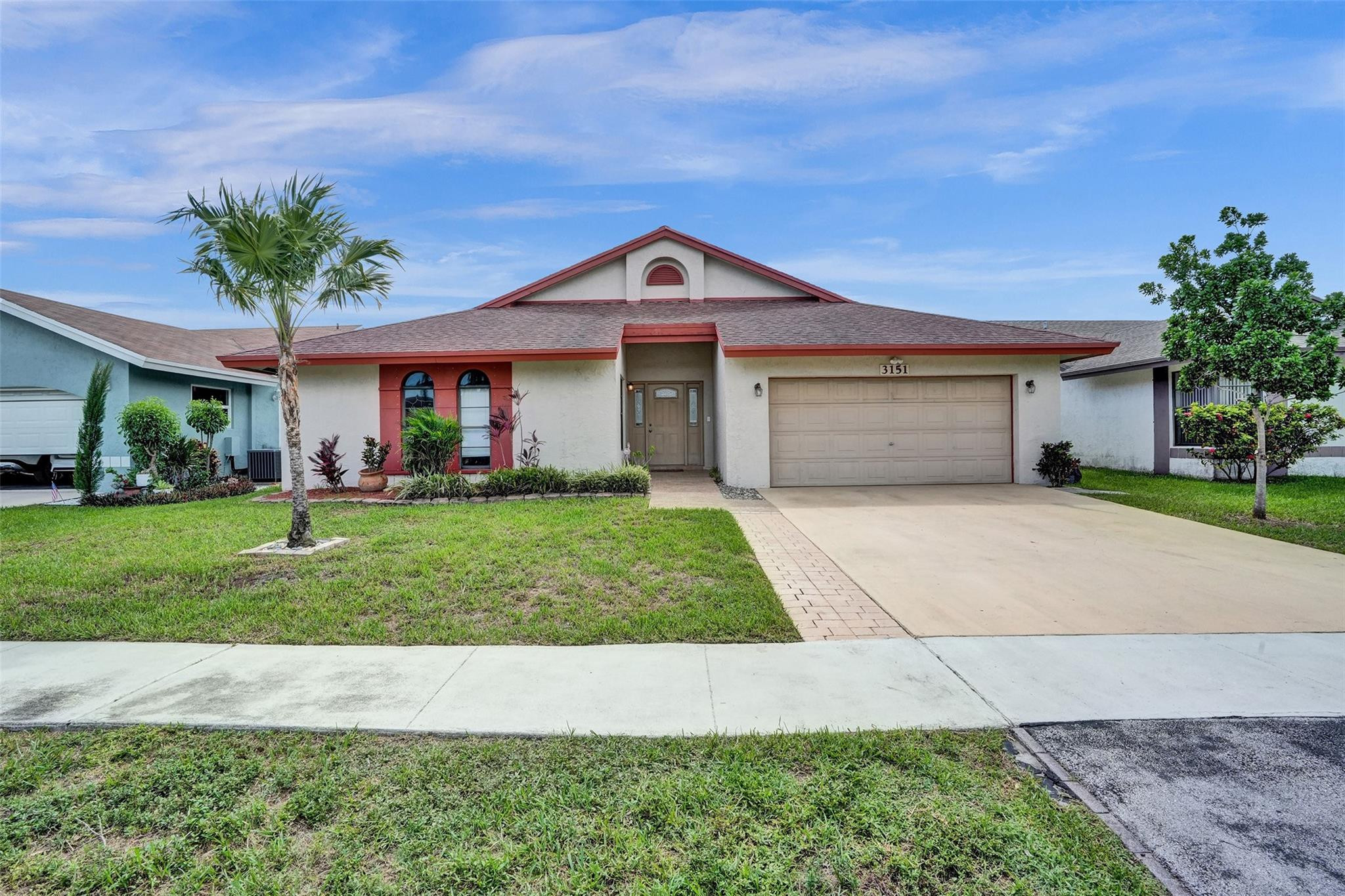 A must see! This lovely 4 bedroom split floor plan with 2 updated bathrooms and Kitchen, a 2 car garage with new washer and dryer, large family room with vaulted ceilings which opens to a large screened covered patio with a spa on it and a soaring ceiling. The home has a large fenced yard that is ideal for entertaining. The community pool is just around the corner to enjoy without the care and maintenance required. This spacious home is conveniently located to enjoy all of the amenities that the City of Sunrise offers at the Civic Center. Great location, close to schools, Sawgrass Mills Mall and major roads.