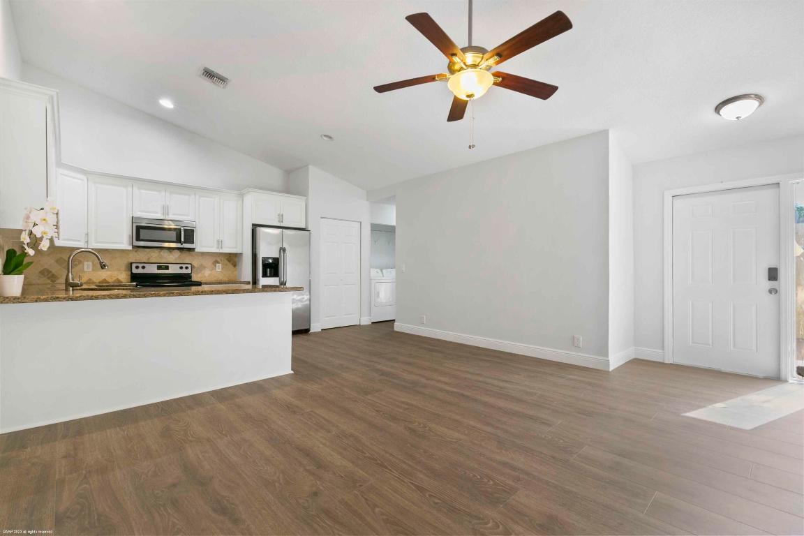 Welcome to this nicely updated, and freshly painted 2 bedroom, 2 bathroom unit, situated within a private quadruplex. New flooring throughout and a split floor plan with ensuite bathrooms for both bedrooms, providing privacy for everyone. Enjoy the outdoors on the open patio and in the backyard, backing up to a quiet canal. Nestled in the heart of Wellington, close to shopping, playgrounds and great schools. 2 assigned parking spots. No HOA and available for immediate move in. DISCLAIMER: All information provided to you regarding this Property by the realtor and her associates has been obtained from third parties such as the Multiple Listing Service, public records and other sources. All Tenants should independently verify all information provided regarding this Property. The Landlord Realtor and Listing broker make no representation as to the accuracy of this information. All Tenants should perform their own independent due diligence regarding this Property before executing a Lease for this Property.