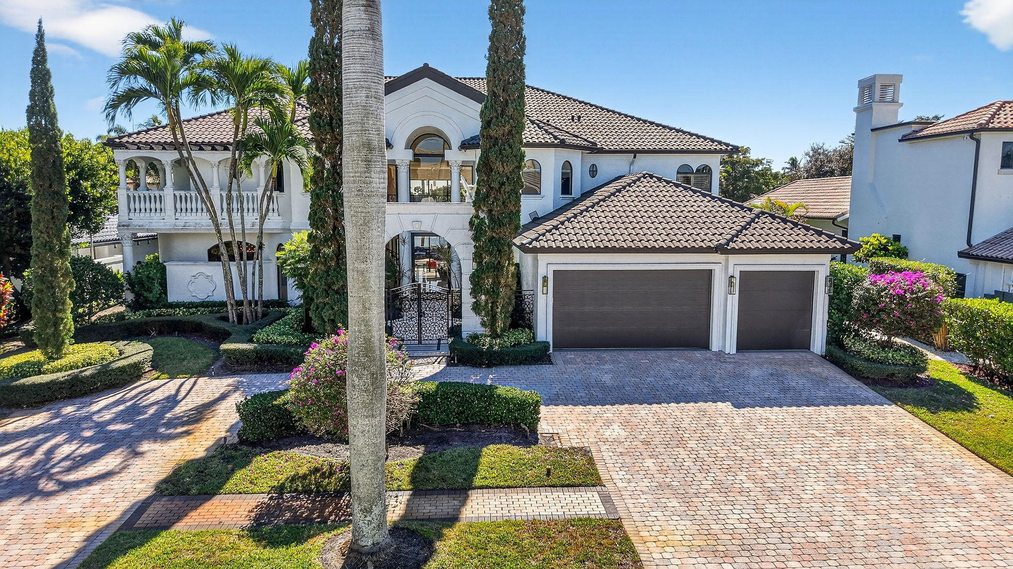 Renovated luxury estate home in St. Andrews Country Club, with long lake and golf course views! The home features 5 bedrooms + office + theater + exercise room, elevator, full-house generator, hurricane impact doors and windows, and more! The gourmet kitchen has Wolf ovens and gas cooktop. The huge master suite has a separate sitting room/office, custom walk-in closets, and his & her bathrooms. All guest bedrooms are ensuite. Outside is a spacious patio with oversized lap pool and spa, summer kitchen with built-in BBQ, and desirable Southern exposure with sprawling lake and golf course views.