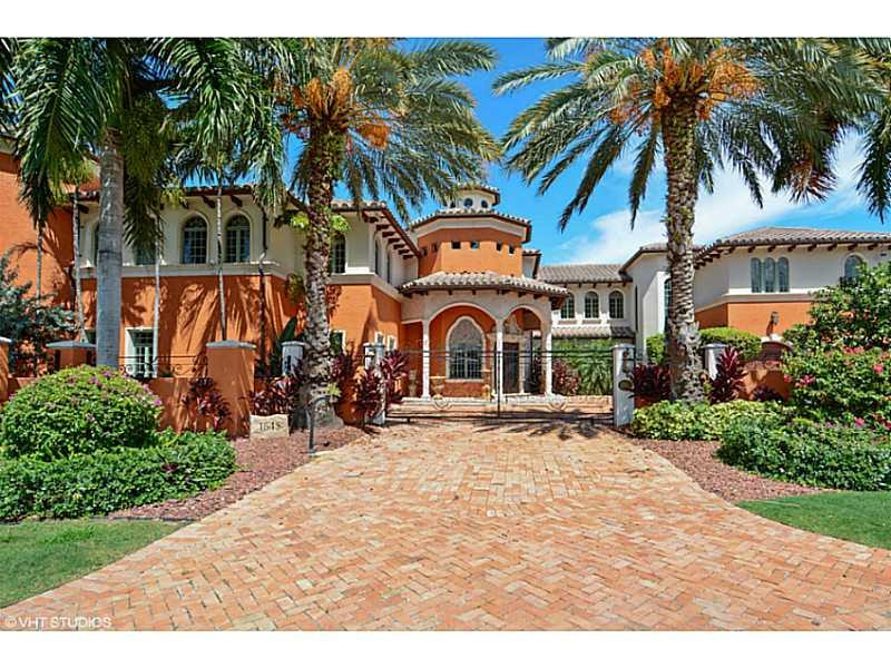 Spectacular walled & gated estate with +/-400' of deep water frontage, dockage for 2 mega yachts, quick & easy ocean access. Gourmet kitchen, lavish master suite w/expansive closets, theater, elevator. Swim-up pool bar & spa, 4 car garage. Lush landscaping, 2 deeded parcels for extra garages or guest house. Tranquil lake views, Prestigious Harbor Beach location, close to air & sea ports, fine dining, shopping & major highways. Private beach club and marina available. Includes $100K upgrade allowance!