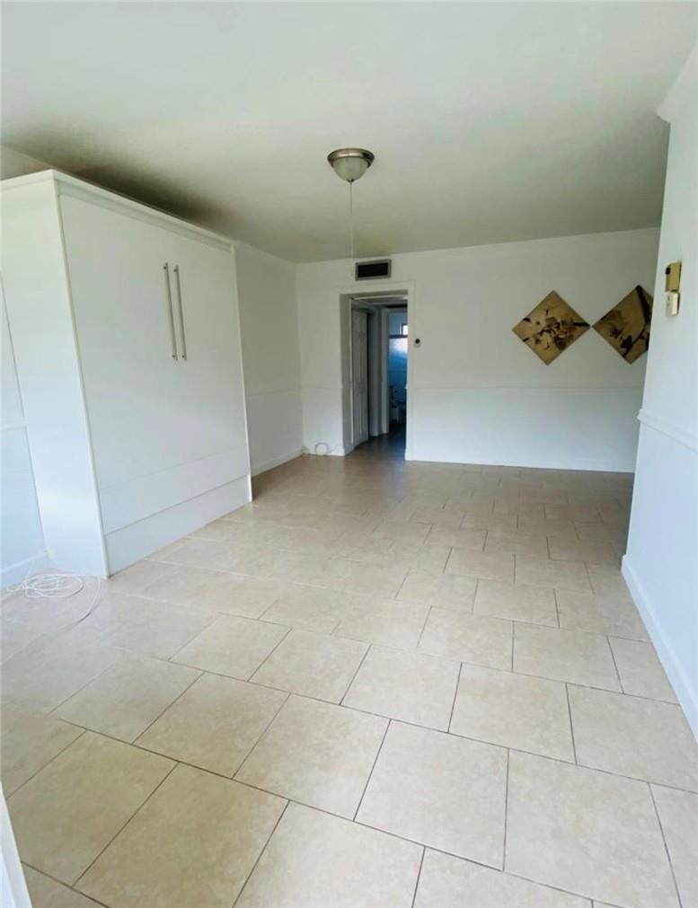 Perfect location 1 Bedroom / 1 Bathroom condo in Hallandale Beach next to a gold course, featuring a fully remodeled bathroom with porcelain finishes, carrara marble shower flooring and a modern tower shower system, tile flooring throughout the entire unit, currently rented and ideal for investors seeking immediate rental income, conveniently located near shopping, dining, beaches, and major highways with excellent investment potential.