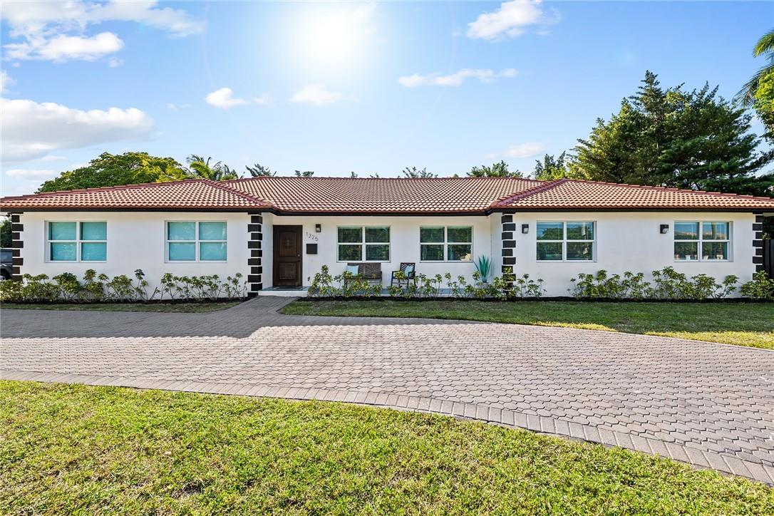 Remodeled 4 bedroom Coral Ridge home situated on oversized 14k+ SF corner lot plus additional 6,500 SF right-of-way. Large private fenced backyard w/ pool, deck & outdoor covered living space. Updated interior with quartz countertops, custom cabinetry. Property features resort-size circular driveway + spacious 2-car garage to accommodate all toys.