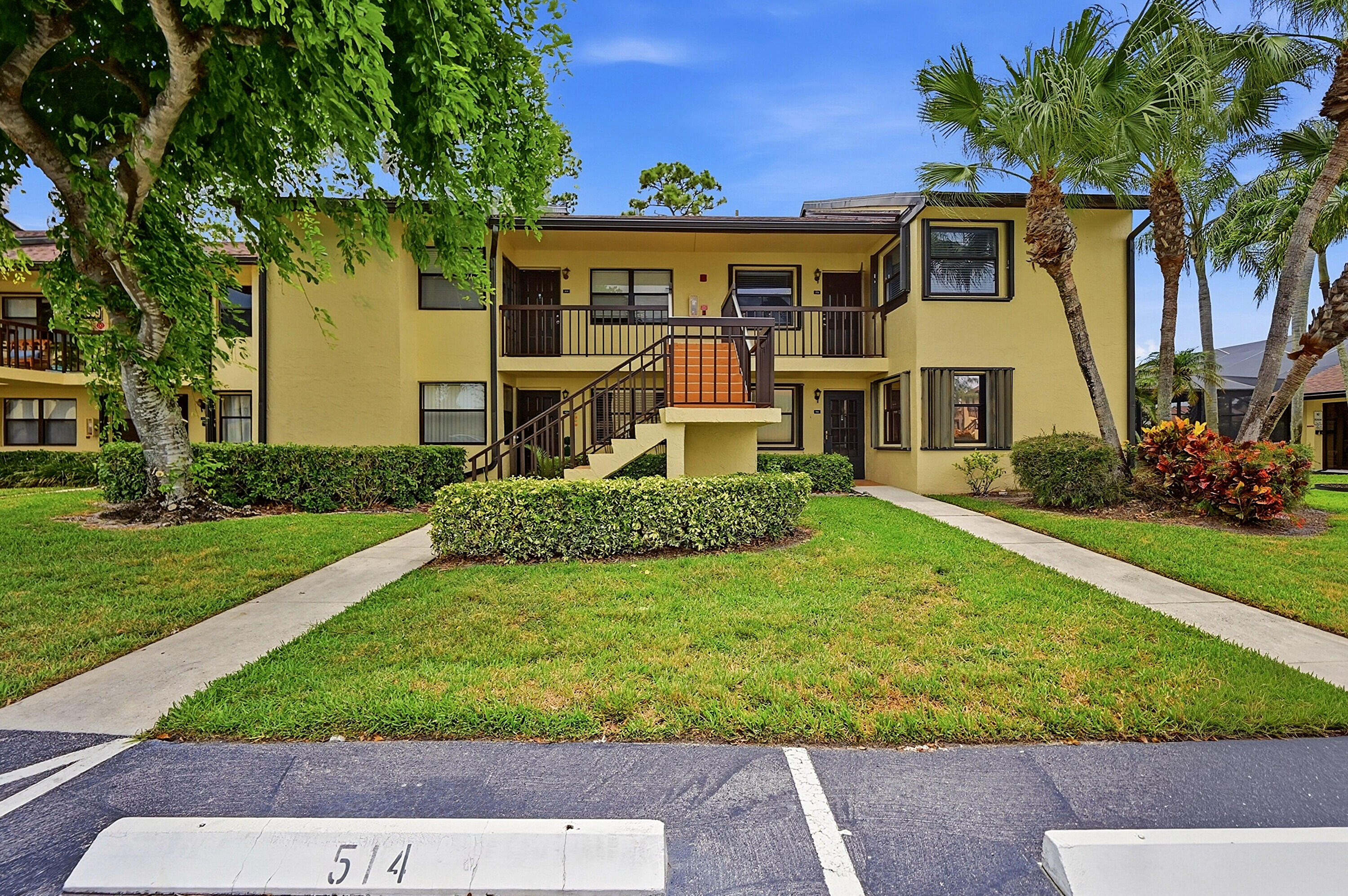 Welcome to this stunning, bright and spacious 2-bedroom, 2-bathroom split floorplan condo WITH potential 3rd bedroom (currently a den with its own closet space). Recently renovated kitchen and newer appliances, as well as renovated bathrooms. This move-in-ready gem brings a fresh & perfect blend of modern comfort and serene surroundings with neutral colors and skylights for a great ambiance. Enjoy your morning coffee or evening relaxation on the enclosed HURRICANE IMPACT window patio space. Minutes from the Turnpike, Wellington's Equestrian Village, and the polo grounds, this home offers great location convenience. Sought-after Lucerne Greens ALL AGES, with access to amenities including a clubhouse, tennis/pickleball courts,  pool, jacuzzi, and renovated community pool table room. Current Washer & Dryer NOT included.
