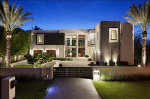 Subtly glamorous modern style captures the essence of Gold Coast living in this brand-new masterwork in The Estates, a prestigious beachside enclave considered the crown jewel of Boca Raton.  Serenely set on the Intracoastal Waterway, this stunningly designed and furnished showpiece is the collaboration of high-end builder J.H. Norman Construction Company, innovative architect George Brewer, award-winning Marc-Michaels Interior Design, and landscape architect Dave Bodker. 

The information herein is believed to be accurate but is not guaranteed & may be subject to errors/omissions & be changed w/o notice. All measurements are approx. Buyer pays title and doc stamps. The five-bedroom residence is a livable work of art based on sleek modular forms, tactile natural finishes, and the latest technologic advances.

Encased in Caribbean coral-stone and impact-glass spans, the bold architecture adds warm contrast with Neolith panels imported from Spain and African sapele wood.  Inside, artistic finishes such as the double-height linear fireplace and walnut accent wall give the open living spaces a balance of drama and intimacy.  Transparent impact-glass walls join all to the outdoor entertainment area and wide view of the Intracoastal Waterway stretching to the tower of the landmark Boca Raton Resort.  Under a canopy of statuesque palms, the sleek geometric pool is itself a work of art.  At nightfall, the exquisite lighting and linear fire-pit set an exotic mood for memorable evening gatherings.  A one-of-a-kind masterpiece in a prized address, this sensational waterfront estate goes beyond every expectation.

Location
Spanish River Road, Boca Raton, Florida.  A sought-after beachside enclave, The Estates is located within walking distance of the famous Raton Resort & Club, close to Mizner Park's world-class shopping and dining.  Boca Raton's private executive airport is only a 15Â±-minute drive.

Property
Fronting 100Â± feet on the Intracoastal Waterway, this brand-new modern masterwork opens its glass-walled living spaces to the coral-stone terrace around the palm-studded resort-style pool with sun shelf and infinity spa.  For outdoor dining, a full summer kitchen serves the loggia, backdropped by a fire-pit.  The residence is presented by an oversized architectural gated motor court, and a volcanic rock cube fountain highlights its entry.  Tall stands of bamboo trees give lush Zen-like privacy to the sides of the grounds.

Residence
This stunning residence is artfully finished and furnished by Marc-Michaels Interior Design, twice named on Architectural Digest's annual AD100 list of the world's top architects and designers.  Five bedrooms, five full and three half baths, two laundry rooms, an elevator, impact-glass windows, and a four-bay garage are provided in the total of 10,876Â± square feet.  Soaring window walls and glass-railed balconies give an unobstructed view of the waterway.  Exquisite imported 36-inch-square Olive Maron marble floors flow through the main level, with 12-inch wide-plank French white oak floors upstairs.  Elegant Italian-made custom built-ins are also featured.  High-tech luxuries include the Lutron HomeWorks lighting/shade control system and Savant audio/video system with three 70-inch Sony televisions. Designer bath fixtures are by Franz Viegener, Dorbracht, and Gessi.

First Floor:  The dramatic two-story window-walled living and dining rooms combine in an effortless open space set off by a coral-and-onyx see-through linear fireplace and a cove-lit mahogany ceiling.  Sharing the fireplace, the window-walled club room has handsomely warm finishes featuring a "floating" mahogany slat ceiling and custom granite-and-wenge-wood wet bar for entertaining.  Separated from the main living space by a walnut accent wall, the bespoke kitchen showcases Italian-crafted Casa Mia cabinetry in contrasting matte lacquer and quarter-sawn-oak finishes, Caesarstone counters, a custom-designed marble backsplash, and Kallista Multiere sink.  For the epicurean, Miele appliances include the debut 42-inch induction cook-top, SensorTronic convection ovens, steam oven, dual dishwashers, and wine refrigerators.  Window walls brighten two sides of the open family/breakfast room with media center.  The powder room is finished in Taj Mahal slab marble, while the cabana bath has dimensional sandstone walls and a private sapele-walled outdoor shower.  A luxurious guest suite completes this level. 

Second Floor:  Open to the living/dining room below, the dramatic glass-railed bridge hall is accessed by the elevator or floating staircase with hand-crafted Spinneybeck handrail covered in glove leather.  Off the hall is a lounge with powder room.  In the southwest wing, the luxe master suite is a dream-like sanctuary in soft-toned hues, with view-filled window walls and a large covered balcony that seems to float above the Intracoastal Waterway.  Adorned in Calacatta marble, the voluminous spa-style master bath creates a serene retreat featuring an Amanpuri Blu-Stone freestanding tub, a Starfire glass-encased multi-head shower with book-matched marble walls, two separate vanities with mirror televisions, and two separate Toto Neorest water closets.  Completing the master suite are two walk-in closets custom fitted with Italian cabinetry.  Three more bedroom suites include one with a waterfront balcony.

Disclaimer: The information provided herein including but not limited to measurements, square footages, lot sizes, calculations and statistics have been obtained and conveyed from third parties such as the applicable Multiple Listing Service, public records as well as other sources. All information including that produced by the Sellers or Listing Company are subject to errors, omissions or changes without notice and should be independently verified by any prospect for the purchase of a Property.  The Sellers and Listing Company expressly disclaim any warranty or representation regarding all enclosed information.  Prospects' use of any information herein is acknowledgement of this disclaimer and that Prospect shall perform their own due diligence.  Prospects shall not rely on this information when entering into a contract for sale and purchase.  Some affiliations may not be applicable to certain geographic areas. If your property is currently listed, please do not consider this a solicitation.   In the event a Buyer defaults, no commission will be paid to either Broker on the Deposits retained by the Seller. "No Commissions Paid until Title Passes."    Buyer pays title insurance, Florida documentary stamps, and all other closing costs for New Construction and land use. Copyright 2016 Listing Company.  All Rights Reserved.