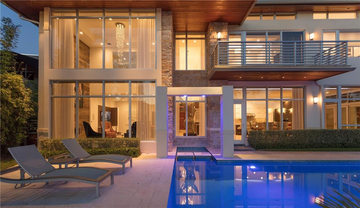 Stunning Modern Architecture enlivens this recently built LAS OLAS Waterfront Estate. The Home lives more like a RESORT with 5BRs/6.2 BA plus a FULL GUEST APT with Summer Poolside Bar/Entertainment area. Huge Open Kitchen with Great room, Living and Dining, all overlooking a 150’ wide canal on a 103’ WF.  Master suite with Huge Bath/Closets.Fresh and functional design, Luxurious Finishes, Control 4, Sub-Zero, Wolf, home theater, fireplaces, so much more. Steps to Las Olas shopping/dining. OVER 9000 TSF