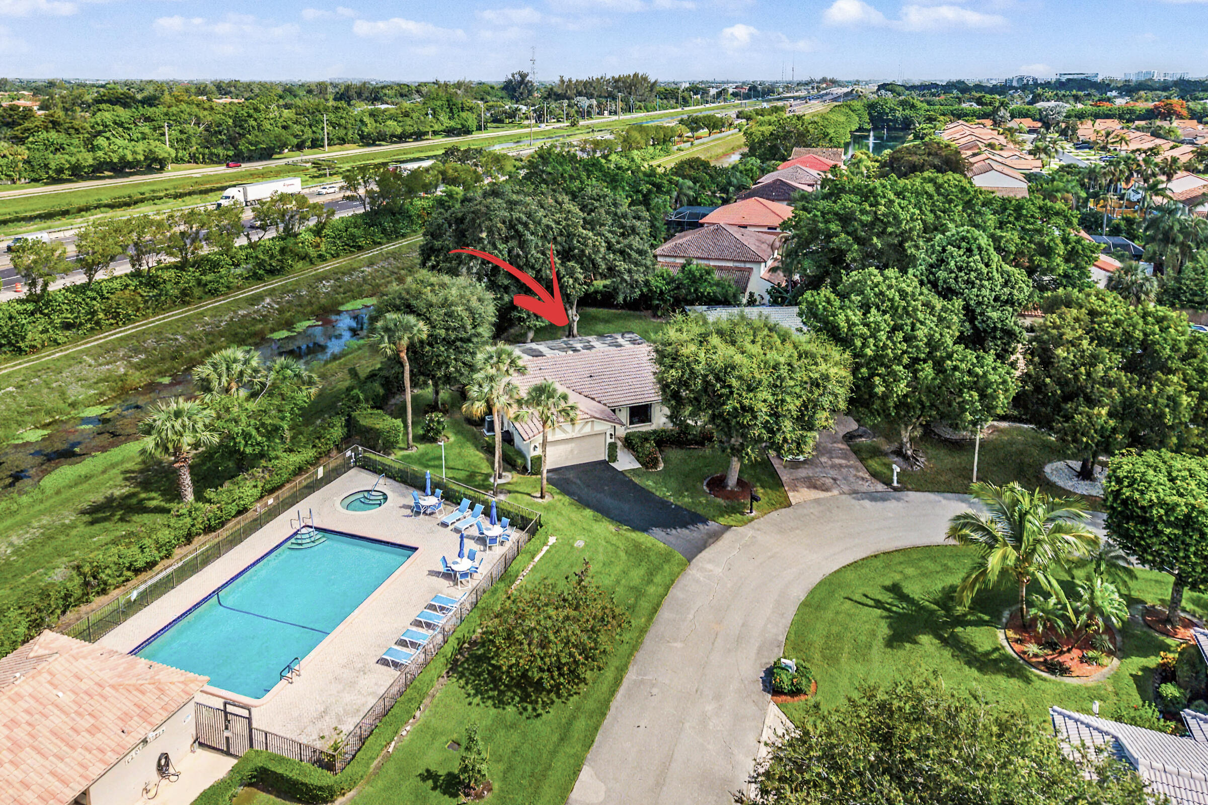 Spacious 3-bedroom, 2-bath single-family home located in the desirable Cloverfield community at Boca Del Mar, in central Boca Raton. This well-maintained home features a 2-car garage, partial impact windows, a covered and enclosed patio, and 1,724 SqFt under air. Situated right next to the community clubhouse and pool, this home enjoys easy access to the neighborhood amenities. Conveniently located near shopping, dining, banks, fitness centers, and numerous places of worship. Cloverfield is a beautifully maintained 55+ community of just 62 homes, with a low HOA fee that includes lawn care, basic cable, roof cleaning, and exterior painting.