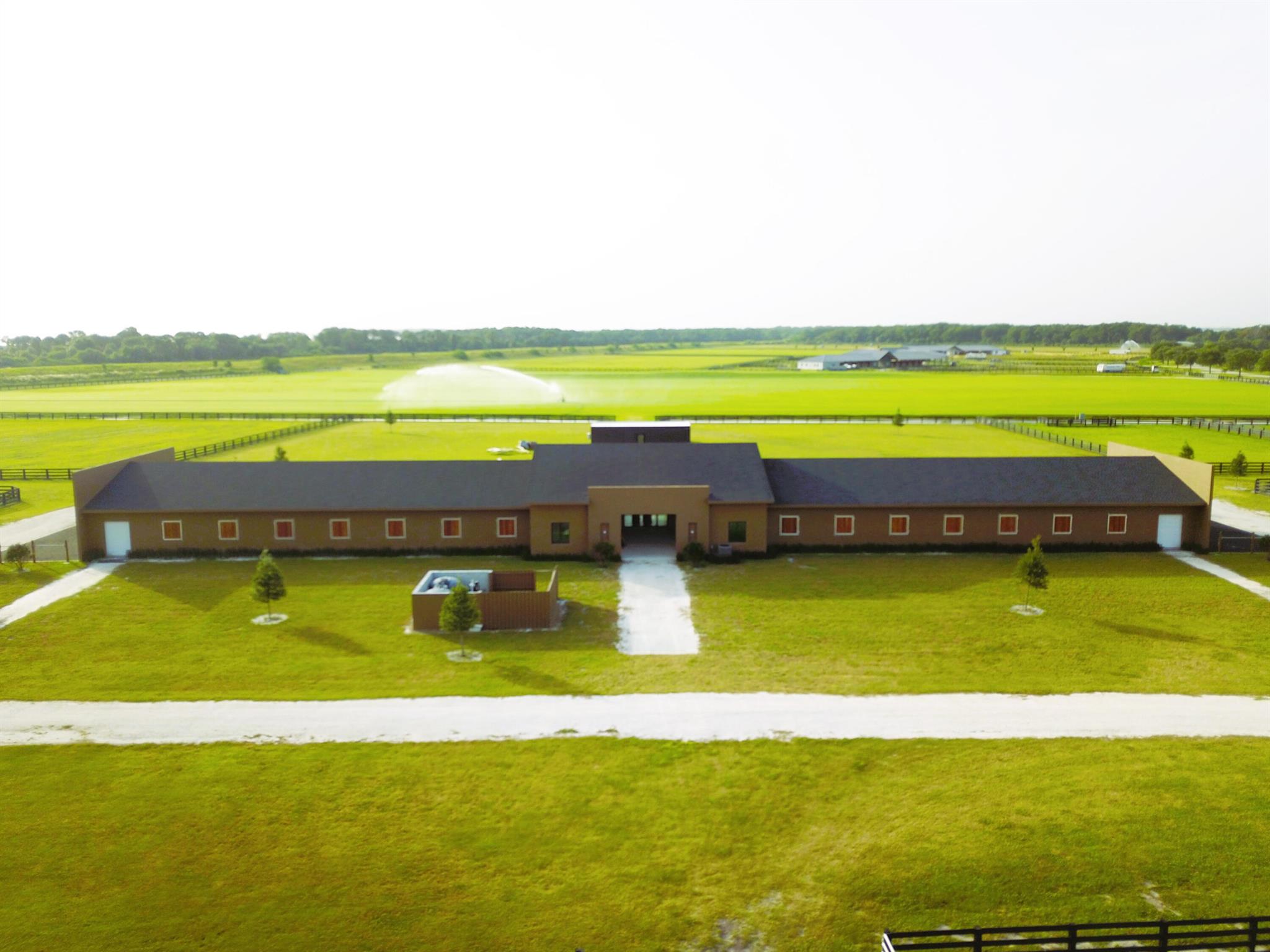 Postage Stamp Polo Farm at Port Mayaca Polo Club is a  turn-key, newly constructed 40 acre polo facility with a private-tournament grade polo field, and highest quality equestrian improvements including a 28 stall barn, separate 3 bedroom groom's residence, Honomobo club-house/lounge overlooking the polo field, extensive paddocks.Postage Stamp Polo Farm at Port Mayaca Polo Club in Martin County, Florida. This turn-key, newly constructed 40 acre polo facility offers the unique combination of a private-tournament grade polo field, together with the highest quality equestrian improvements including a 28 stall barn, separate 3 bedroom groom's residence, Honomobo club-house/lounge overlooking the polo field, extensive paddocks.
