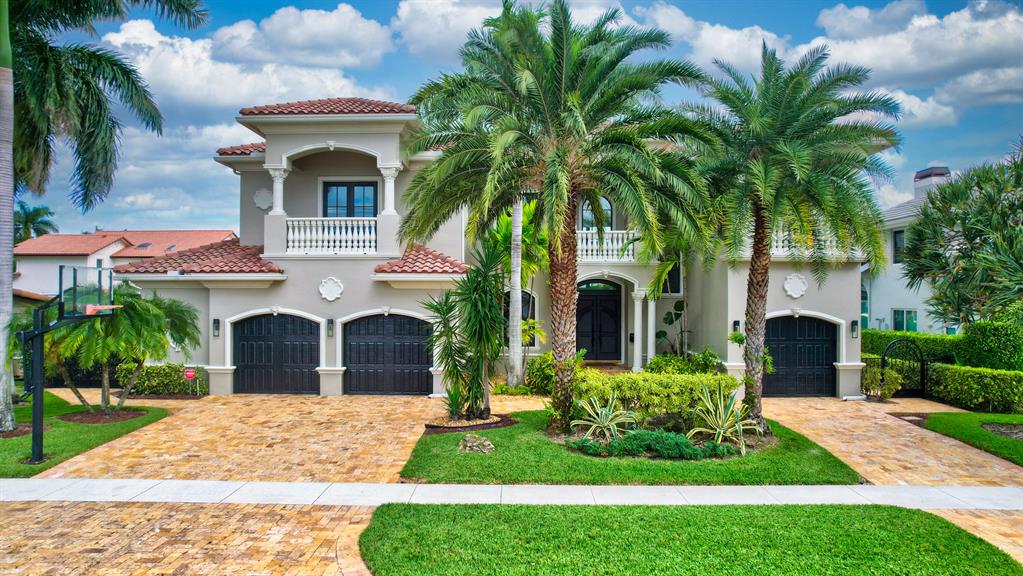 No detail has been left untouched in this magnificent waterfront estate in the exclusive Lake Rogers Isle community.  Truly built with old world craftsmanship this home exudes elegance.  60ft dock with easy ocean access (NO FIXED BRIDGES), wide water views and close proximity to beach.  5 Bedrooms, 6 Baths, 3.5 Car Garage.  Master VIP suite includes separate steam room and cabana access. 2nd Master bedroom on 1st floor. Laundry upstairs and downstairs, hydraulic elevator, double pane impact windows and full concrete construction.  No detail has been missed.  Imported 3/4'' imported marble floors, 3/4'' hardwood floors, temperature controlled wine room, dual dish washers, Miele refrigerator, built in coffee maker, wolf range/oven and whole house generator.  Outdoor covered kitchen. Sundeck.