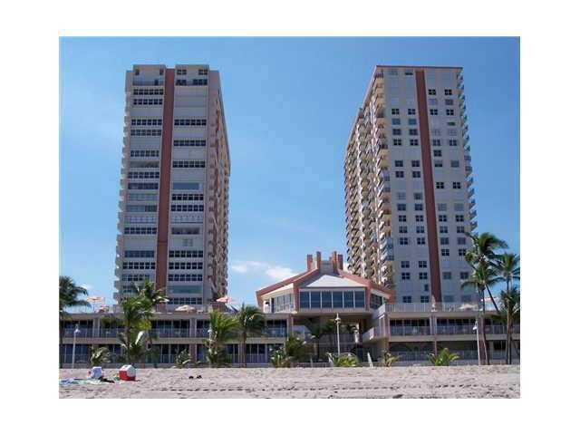 Seller Financing Available! Bright SW corner 2BR/2BA updated condo w/unobstructed SE ocean views, the city, stunning sunsets in the west and the Atlantic Ave bridge - just steps to the beach.  Features include white tile throughout, walk-in closet in main BR, hurricane shutters in every room plus high impact windows/doors, excellent dedicated garage parking spot.  Bldg includes basic cable & internet.  Enjoy the modern clubhouse amenities including gyms, game room, saunas, 2 pools (1 w/jacuzzi) and a cafe/bottle club.  Conveniently located near the Pompano Beach Pier and promenade w/new boutiques and 4star restaurants and snack shops.