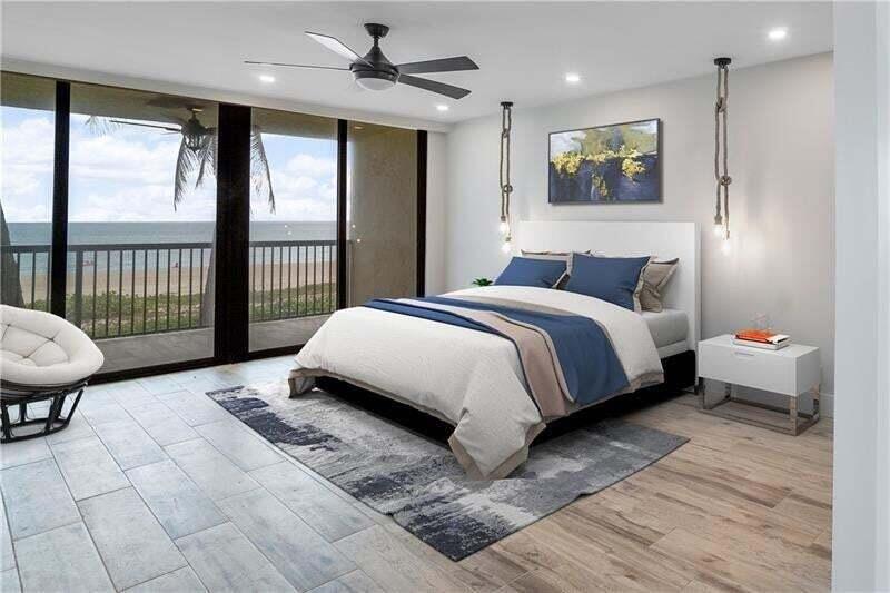 Rare direct oceanfront townhome-style residence offering the feel of a private beach house with the ease of condominium living. This beautifully renovated 3-bedroom, 3-bath oceanfront home features approximately 2,282 adjusted sq. ft. of coastal-modern living, expansive ocean views, floor-to-ceiling sliders, multiple outdoor living areas, and direct access to the sand. The main living level is bright, open, and fully updated with wide-plank wood-look tile flooring, recessed lighting, clean neutral finishes, and a designer kitchen featuring white shaker cabinetry, quartz countertops, stainless steel appliances, farmhouse sink, custom wood hood accent, pendant lighting, and an oversized peninsula ideal for entertaining. The living and dining areas flow seamlessly to a private oceanfront patio and green space, creating a true indoor/outdoor beachfront lifestyle.  Upstairs, the spacious oceanfront primary suite offers stunning beach views, private balcony access, modern lighting, generous living space, and a spa-inspired bath with dual vanity and walk-in shower. The additional bedroom is well-sized and flexible for guests, family, or office use, with beautifully renovated baths throughout.  Enjoy the rare combination of a renovated two-story oceanfront residence, private outdoor space, oceanfront pool area, in-unit laundry, and an unbeatable Pompano Beach location near the Pier, Fishing Village, oceanfront restaurants, shopping, and entertainment. The nearby Pompano Beach Fishing Village includes restaurants and retailers such as Beach House Pompano, Oceanic, Lucky Fish, BurgerFi, Kilwins, Baresco, and How You Brewin Coffee Company.  A truly special opportunity to own a move-in-ready luxury oceanfront residence in one of Pompano Beach's most desirable beachfront locations.