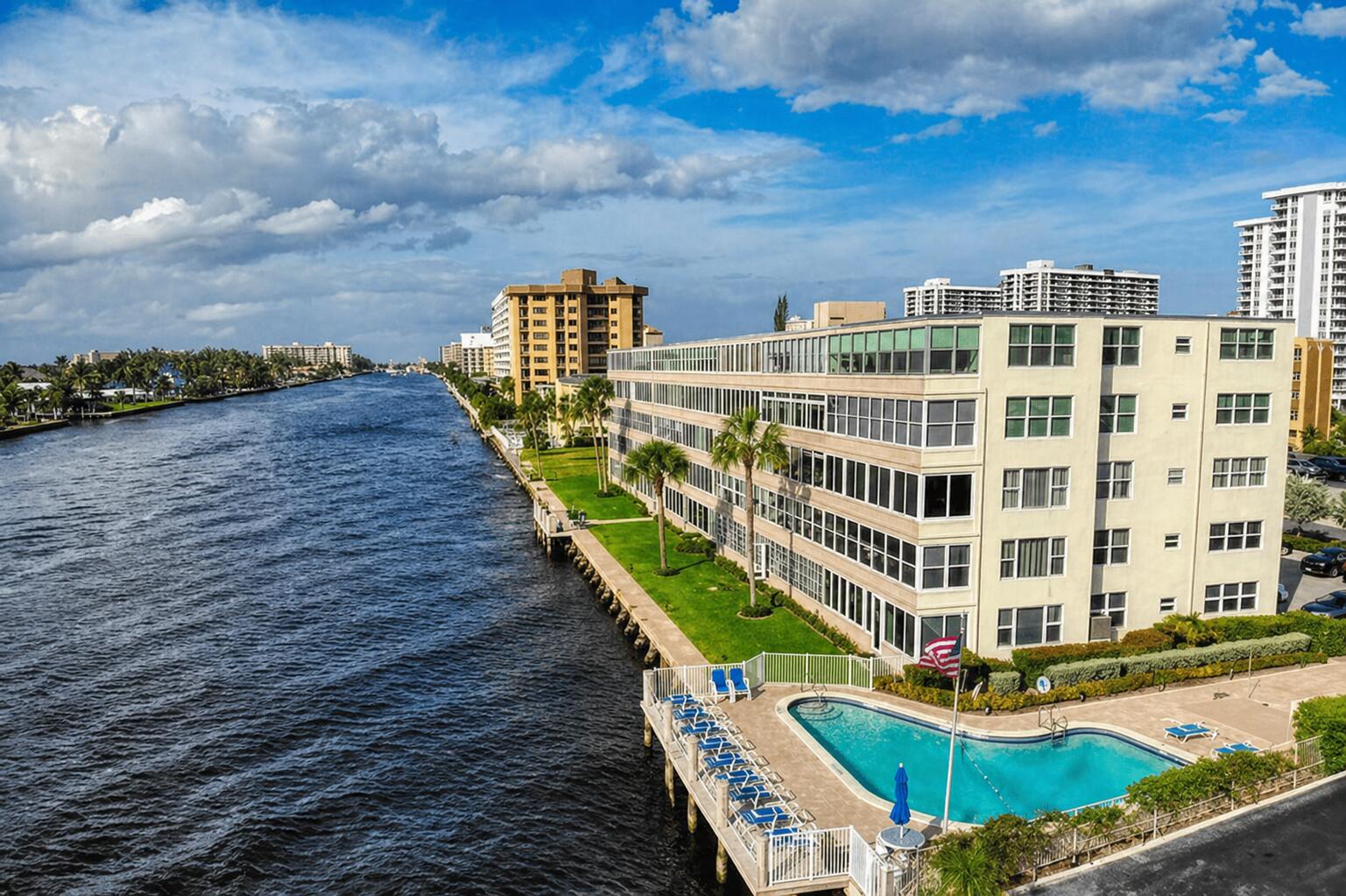 Upgraded corner unit in a charming boutique Intracoastal building! This bright and airy 2BR/2BA residence offers an open-concept layout and a stylish gourmet kitchen with a center island, snack bar, stainless steel appliances, granite countertops, and solid wood cabinets with pull-out drawers and a tumble marble backsplash. Features include central A/C, high-impact windows and doors, and a flexible second bedroom/den/office. The primary suite includes double closets for ample storage. Prime location within walking distance to Pompano Beach, the fishing pier, Beach House, and Oceanic—perfect for enjoying the area's vibrant coastal lifestyle. OWNER IS WILLING TO HOLD MORTGAGE. Preferred lender offers Co-op loans with as little as 15% down for primary and 20% down for 2nd home and investments