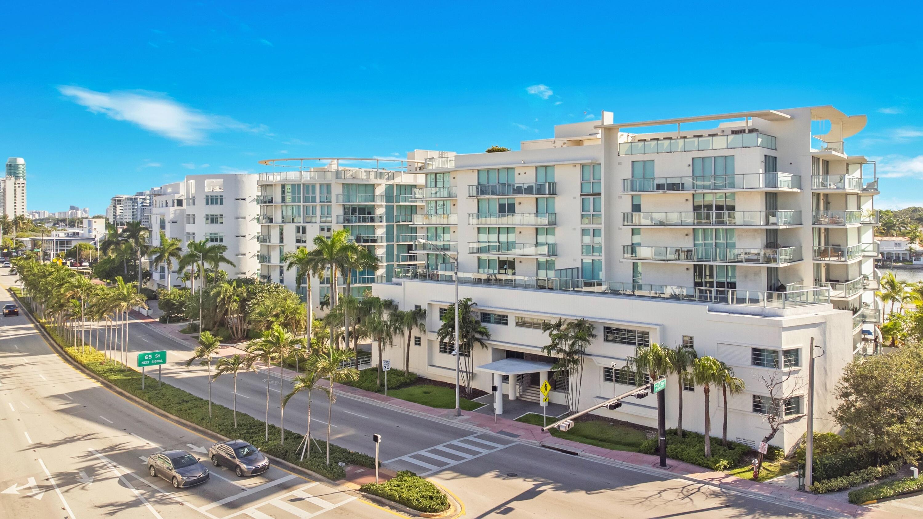 Fully furnished & move-in ready! This rare 3-level townhome-style residence at Peloro offers 1,224 SF with 1BR plus a versatile den - ideal as a home office or guest room - 1.5 baths, and a private rooftop terrace with stunning intracoastal views. Features include impact glass, ceramic tile flooring, full-size in-unit washer/dryer, and 1 assigned garage space. Boutique building with only 113 units, just one block from the beach. Building amenities: 24-hour concierge, valet, pool, jacuzzi, sauna, gym, and library/business center. HOA covers cable, Wi-Fi, water, common areas & pool service. Unbeatable location - steps to Publix, minutes to Bal Harbour Shops, and 20 min to MIA. Leasing permitted up to 12x/year (30-day min), great for investors. Furniture included - just bring your suitcase!