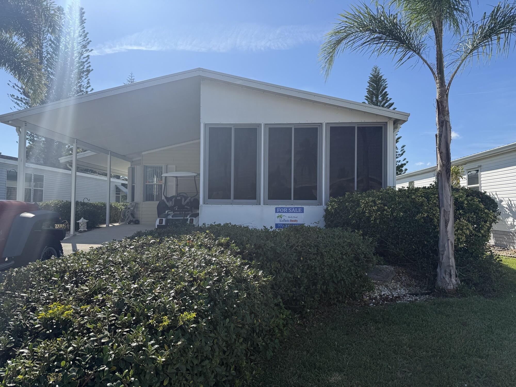 Welcome to this charming turn key 2-bedroom, 2-bathroom manufactured home which even includes a golf cart. Located in Spanish Lakes Fairways 55+ community. Offering 1,200 square feet of comfortable living space across a single story, this property provides an efficient layout perfect for those seeking a manageable home in an established community. The two full bathrooms ensure convenience for residents and guests alike, while the thoughtful floor plan maximizes functionality throughout. This home presents an excellent opportunity for buyers seeking an affordable home near beaches, restaurants and shopping.  Lawn care and trash removal are included in the lot rent. The community features two pools, golf, tennis, pickleball, bocce ball, shuffleboard, Clubhouse and much more.