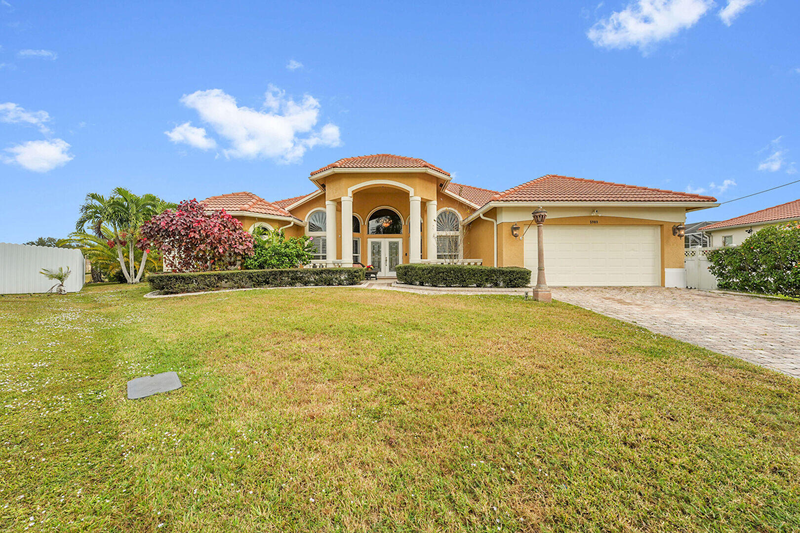 ASSUMABLE MTG at 3.5% Welcome to your dream home in the perfect location! Close by Clover Park, Walmart, Indian River College & more. This stunning 3-bedroom 2-bathroom and a den/office has been maintained and is ready for you to move. Home w/countless upgrades! Master suite offers a luxurious walk-in shower with dual shower heads, jacuzzi tub, double sinks, & spacious walk-in closet, & direct access to a backyard patio. Home with features a cooking island kitchen, a central vacuum system, a propane generator, and a fully tiled garage w/mini-split AC, full wall storage cabinets, a workbench station, pull-down attic stairs with ample storage space. The property boasts a well irrigation system & offers view of a grassland retention pond, creating a peaceful bird preserve atmosphere.