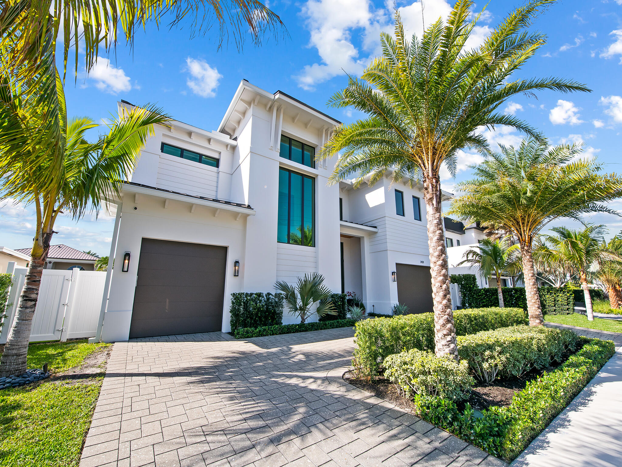 A newly built 2024 estate positioned on 80 feet of prime Lighthouse Point waterfront with no fixed bridges and direct ocean access. Offering 5,250 SF of thoughtfully designed interiors, including 5 bedrooms, 6 baths, a dedicated office, and an elevator. Walls of impact glass, tile and wood flooring, custom built-ins, and refined finishes carry throughout. Outside, the estate rivals a private resort with heated pool, spa, covered entertaining areas, built-in BBQ, and a private dock. All ready for the South Florida boating lifestyle. One of the finest waterfront values in Lighthouse Point. Schedule your private tour today.
