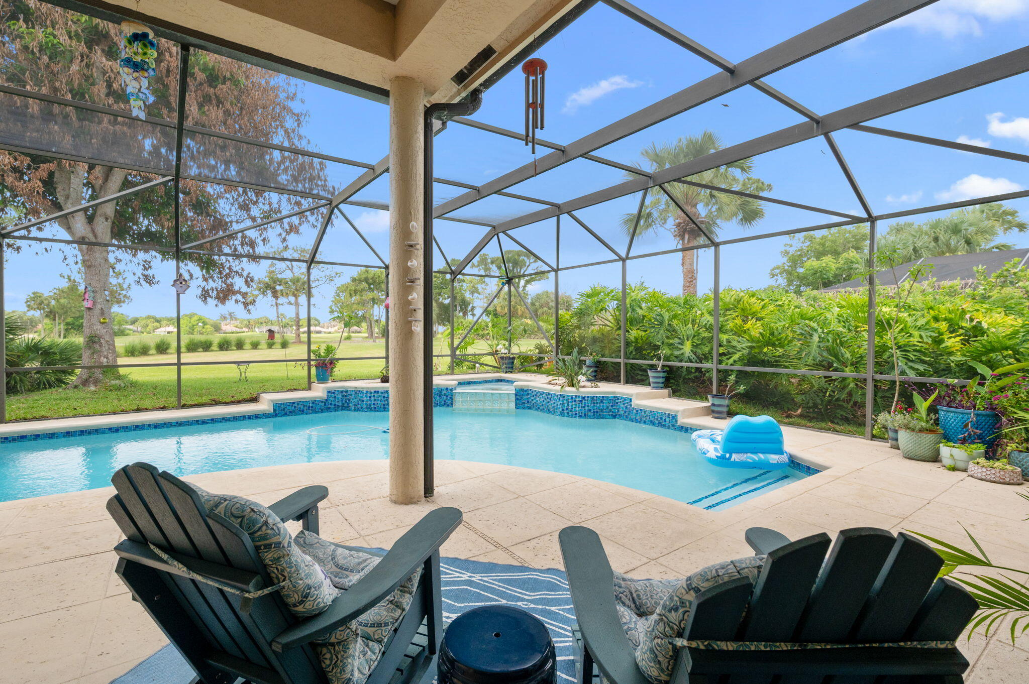 Beautifully designed home in Country Club Estates of Port St. Lucie. This home is situated on an oversized lot with beautiful golf views and mango trees!  Large formal dining and living room as you walk in. Spacious master suite with soaking tub, shower, dual sinks and walk in closet. Kitchen is open to family room with breakfast nook looking out to pool. New french door refridgerator.  3 additional bedrooms with 2nd full bath with cabana door and half bath off kitchen. Large 2.5 car garage with separate golf cart bay and separate door. Newly converted salt water pool has been resurfaced and retiled. Gas water heater 2023, two new AC units in 2022 & 2023. Inside laundry room with new washer and dryer. New LED lighting in home.  HOA dues include basic cable and internet.