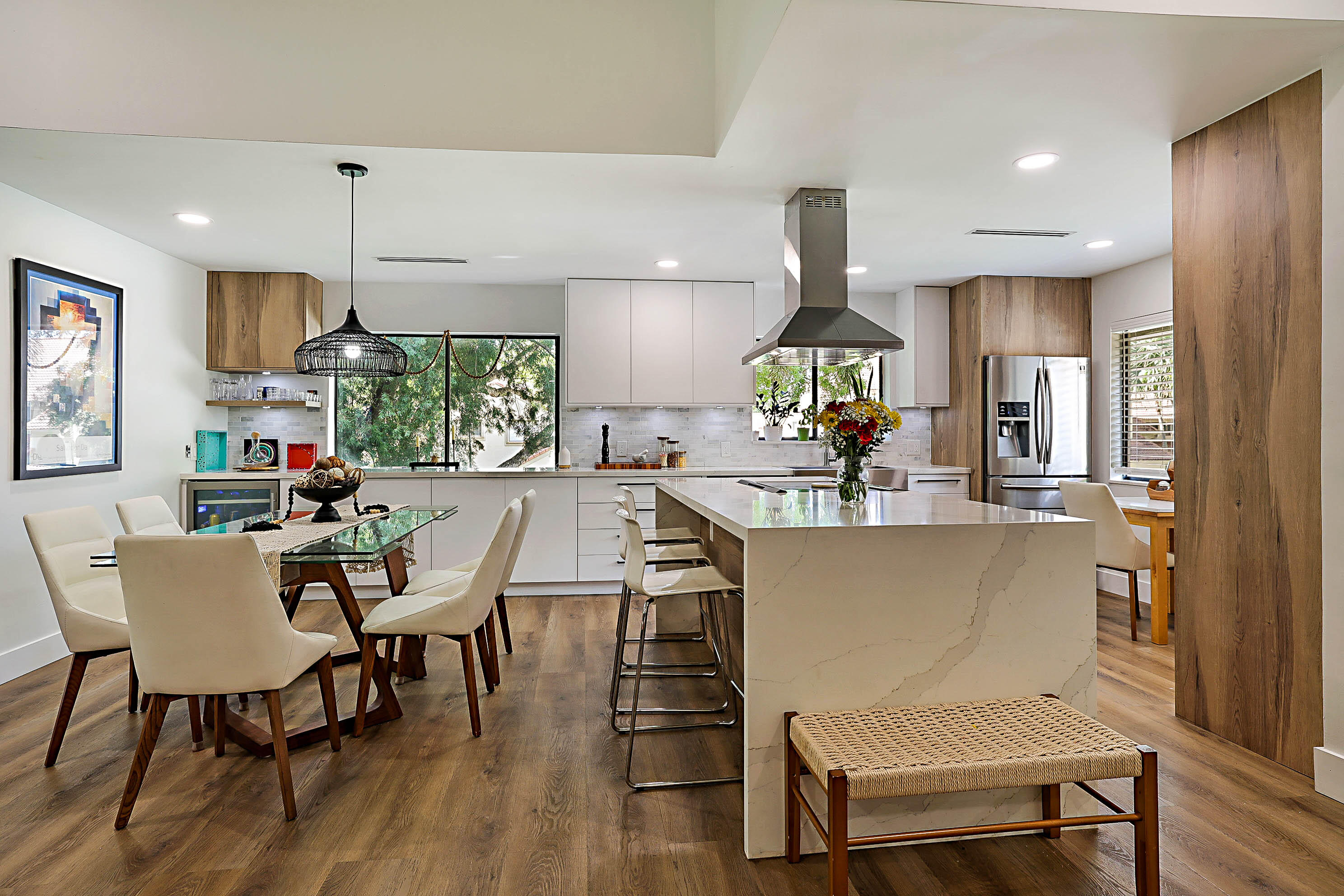 This is truly a one-of-a-kind 3-bedroom, 2-bath second-floor coach home with attached garage located in the highly desirable Coach Houses of Town Place in Boca Raton. Thoughtfully and masterfully redesigned by award-winning architect Anabella Garcia, this stunning residence seamlessly blends modern sophistication with exceptional functionality. The home was completely remodeled with an open-concept design ideal for today's lifestyle and entertaining. The kitchen was transformed by opening the walls to create a bright, flowing space centered around a spectacular quartz waterfall island, complemented by sleek Italian-style cabinetry and contemporary finishes throughout. As a desirable corner unit, the home is flooded with natural light thanks to additional windows in the kitchen and dining  areas, creating a bright and airy ambiance as well as beautiful vaulted ceilings. Additional upgrades include beautifully renovated bathrooms, tile flooring throughout, designer details, and a spacious layout that feels both elegant and inviting. Perfectly situated just steps from the community pool, the pool and tennis center of Boca Raton, Town Center Mall, fine dining, shopping, and entertainment, this prime location also offers quick access to I-95 and is just minutes from Boca Raton's beautiful beaches. A rare opportunity to own a designer-renovated residence in one of Boca Raton's most convenient and sought-after communities.