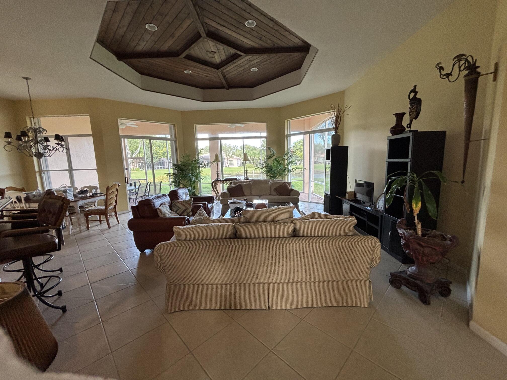 Beautifully maintained 3/2/2 home in well established  55+ community.  Large open floor plan with screened patio overlooking the lake.