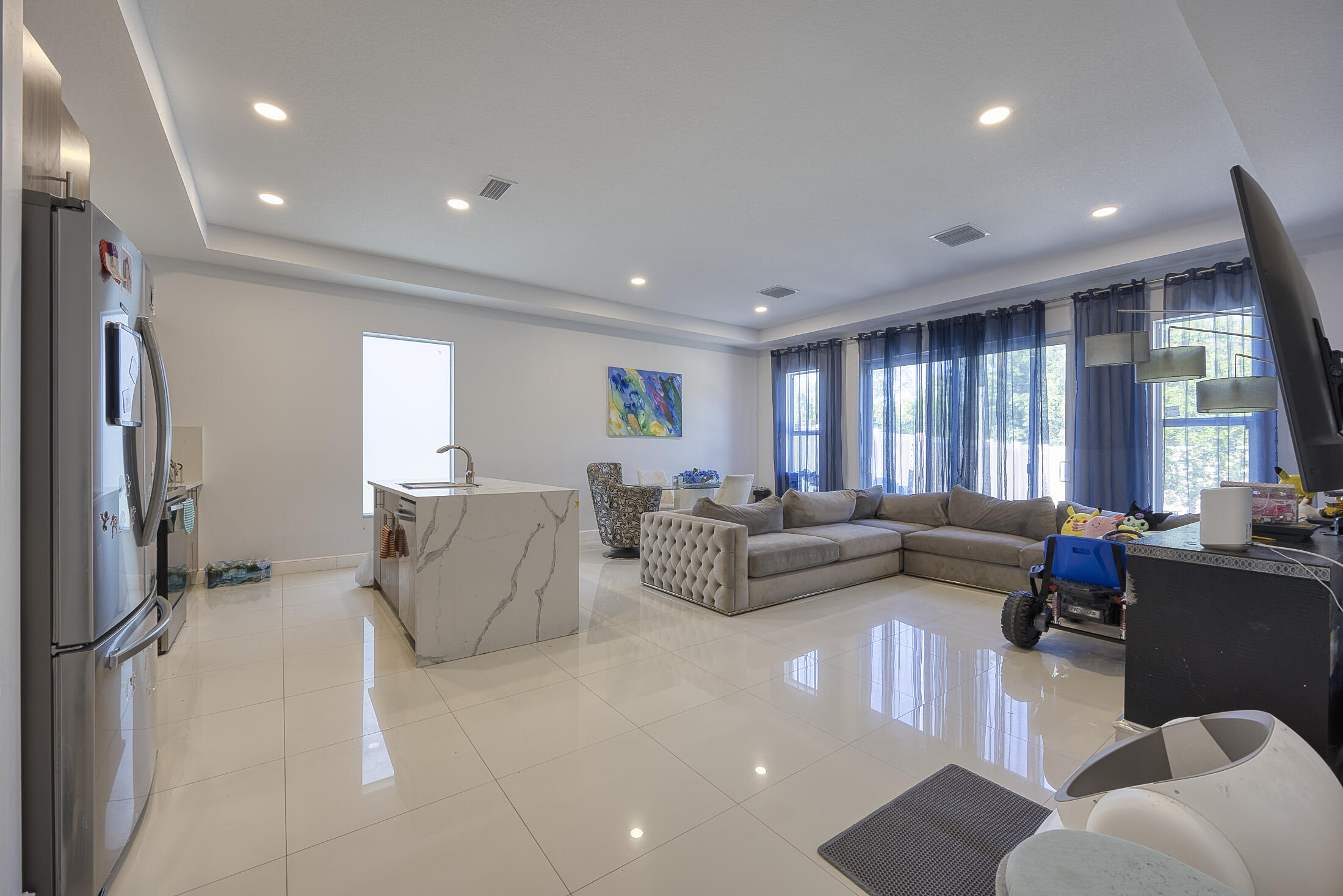 Dream Home in West Palm Beach! Welcome to 941 Fitch Dr — a stunning 2020-built home with 3 beds, 2.5 baths, and 1,750 sq ft of modern living space. Step inside to soaring 10-ft ceilings, beautiful porcelain tile floors, and abundant natural light. The gourmet kitchen features quartz countertops with a large waterfall island, high-end cabinetry, and stainless steel appliances. The primary suite is a retreat with a huge walk-in closet and spa-like bath. Plus, a flexible bonus room perfect for office or guests. Standout perks: Super low HOA of just $117/month (includes lawn care and well water for sprinklers) Pets welcome! Great location with easy access to shopping, dining, beaches & highways. Stylish, low-maintenance living at its best! Schedule your showing
