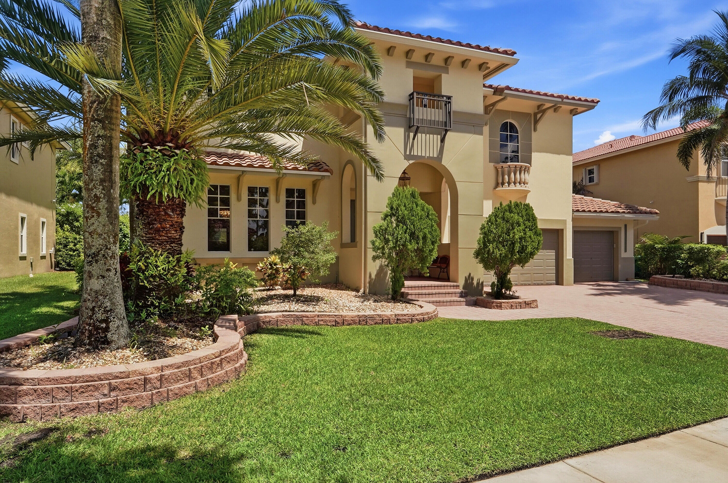 4BR/3BA lakefront pool home with a spacious loft (easily converted to a 5th BR), 3-car garage, and over 4,000 SF of living space. Major recent updates include a NEW ROOF (2024), remodeled kitchen (2023), NEW kitchen appliances (2026), both A/C units replaced (2024), interior and exterior paint (2023), backyard pavers (2024), NEW pool equipment and saltwater system (2025), and NEW washer/dryer (2026). The spacious floor plan features soaring 20+ ft ceilings in the living and dining rooms, abundant natural light, and an oversized lakefront backyard with desirable eastern exposure and beautiful sunrise views. Located in Heron Bay's sought-after Highlands community, residents enjoy resort-style amenities, multiple pools, fitness centers, tennis courts, parks, walking trails, and access to top-