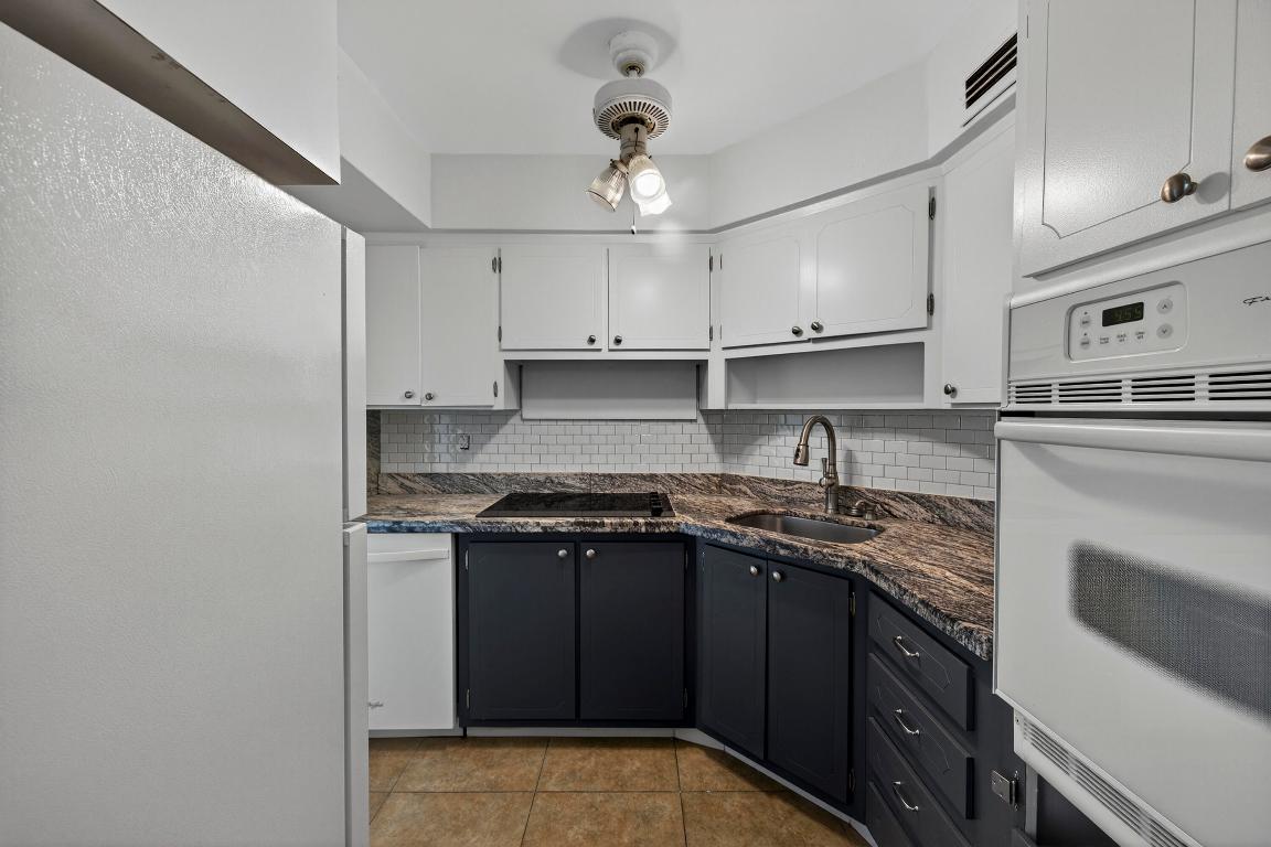 Welcome to Venetian Gardens in Lighthouse Point. This bright and inviting 1 bed/1 bath unit features an open living area with tile flooring throughout, an updated kitchen, excellent storage, and access to a screened patio surrounded by lush greenery. Enjoy peace of mind with partial hurricane-impact windows and doors. The bedroom offers a walk-in closet and relaxing garden views. A/C is only 3 years old.  Recent updates include a new roof, completed 40-year inspection, and fully funded reserves. The unit is conveniently located close to the community pool. Community amenities also include a pickleball court, clubhouse, outdoor kitchen/BBQ area, picnic space, car wash, and on-site laundry.  Association fees include water and cable. Can be rented once during the lifetime of ownership. Cash only. All ages welcome. This is a Co-Op community with NO land lease.