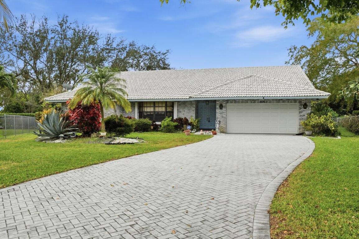Major price improvement! With comps and AVMs much higher, this is a rare opportunity to secure one of Pine Ridge's best values while adding your own personal touches and building instant equity! Tucked away on a quiet cul-de-sac in one of Coral Springs' most sought-after neighborhoods, this pool home sits on an oversized lot backing to a canal, offering privacy, open space, and the South Florida lifestyle. Vaulted ceilings and multiple living areas create an airy, open feel, while the expansive backyard and large pool provide endless possibilities for entertaining, relaxing, or future enhancements. Key features include a 2024 A/C, tile roof (2005), accordion shutters, low HOA, and a prime location close to top-rated schools, parks, shopping, dining & major roadways. Don't miss this one!