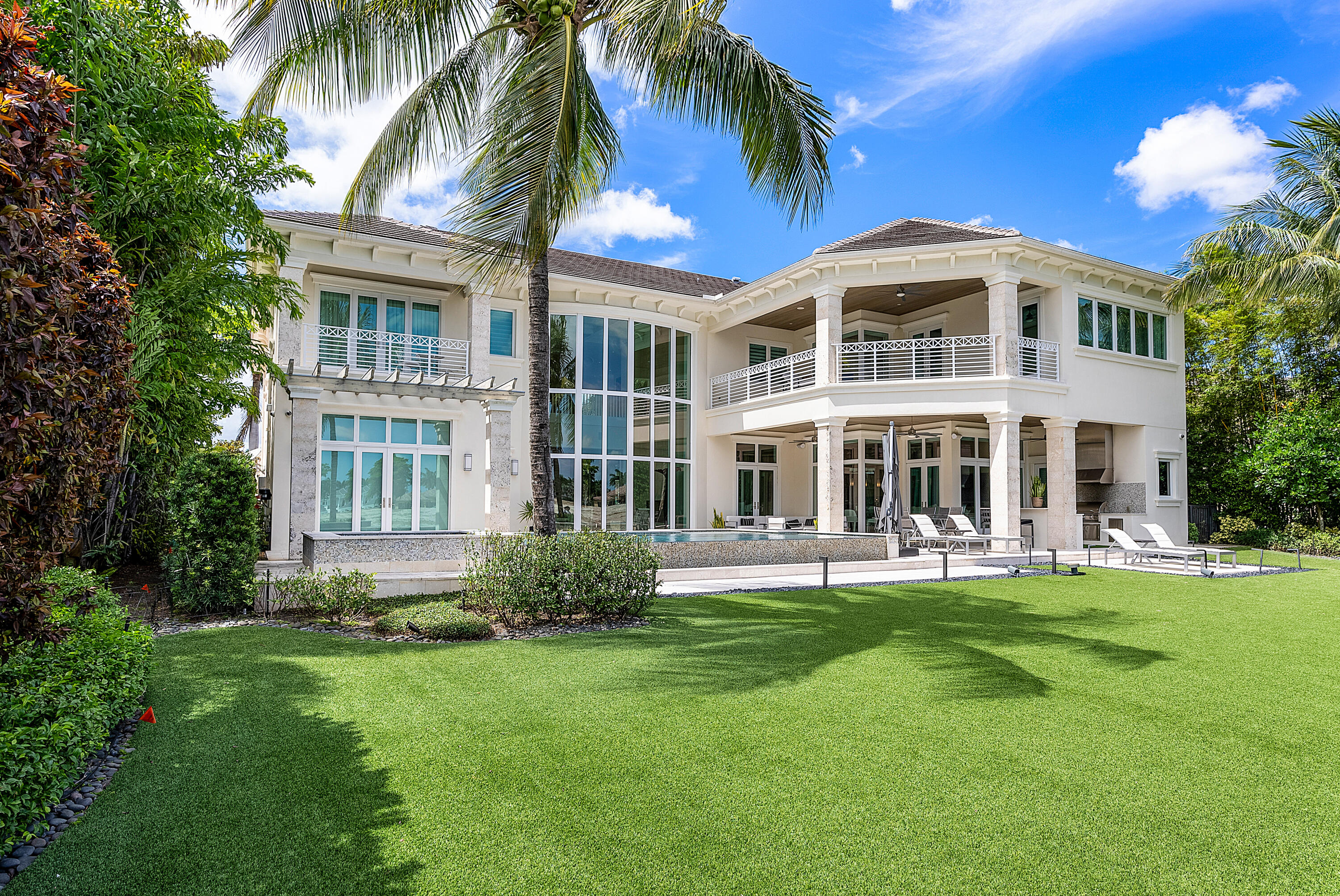 Located on one of the most spectacular lots in St. Andrews CC, this southern facing residence overlooks a double fairway and expansive lakes. Constructed in 2017, this stylish and bright home offers 5 bedrooms, a home theater, loft, 7 full and 1 half bathrooms and approximately 8,400 sq. ft. of living area.
The spacious master suite encompasses nearly half of the second floor and features large, luxurious his and her closets, exquisite his and her baths, and phenomenal views of the golf course and lakes. A stunning gourmet chef's kitchen features top-of-the-line appliances and overlooks the pool and outdoor entertaining areas. All ancillary bedrooms are en suite and offer spacious walk-in closets. Extras include a whole house generator, 4-car garage, summer kitchen and elevator. Offered fully furnished, excluding artwork.
