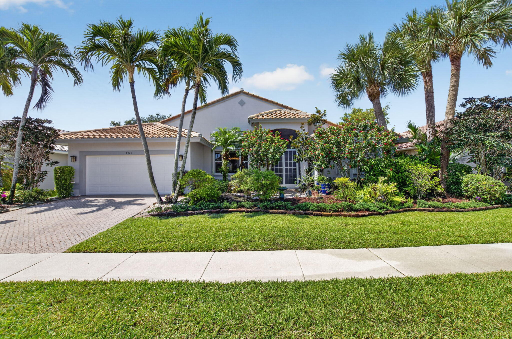 Welcome to your own piece of PARADISE in the sought after community of Boynton Beach! The home features 2445 sq ft of living space! Bright open floor plan with vaulted ceilings and impact windows and doors throughout.  Large gourmet kitchen features 42 inch white cabinets with  glass doors updated appliances, pull outs & beautiful granite counter tops! Central air conditioning   2016  & hot water heater 2024! The garage motor is new and opens and closes silently. The expanded  screened lanai overlooking the private salt water pool is the perfect spot to enjoy your morning coffee or your evening cocktails!  The primary suite features coffered ceiling,  luxury flooring, 2  walk in closets, 2 walk in showers  and dual sinks!  Beautiful plantation shutters and crown molding enhance this home!